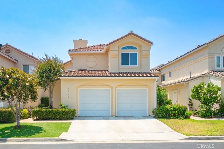Welcome to this beautifully updated home in the gated VERDI Collection community of central Torrance. Recently painted with brand new carpet, this spacious residence offers an open-concept layout filled with natural light. The gourmet kitchen features a Jenn-Air cooktop island, granite counters, Sub-Zero refrigerator, and a breakfast nook with garden views.

The family room boasts cathedral ceilings, custom built-ins, and glass doors leading to a private landscaped patio with a fountain—perfect for indoor-outdoor living. A formal living and dining area with a fireplace makes entertaining easy.

Upstairs, the primary suite includes vaulted ceilings, a large walk-in closet, and a spa-like bath with Jacuzzi tub, glass shower, and dual sinks. Two additional bedrooms and a full bath complete the upper level.

Additional highlights include crown molding, skylights, solar tubes, new blinds, tankless water heater, new LG washer/dryer, water softener with reverse osmosis, central A/C and heat, security system, and a finished garage with 220V power.

Conveniently located near top-rated schools, Wilson Park, shopping, dining, healthcare, and beaches.