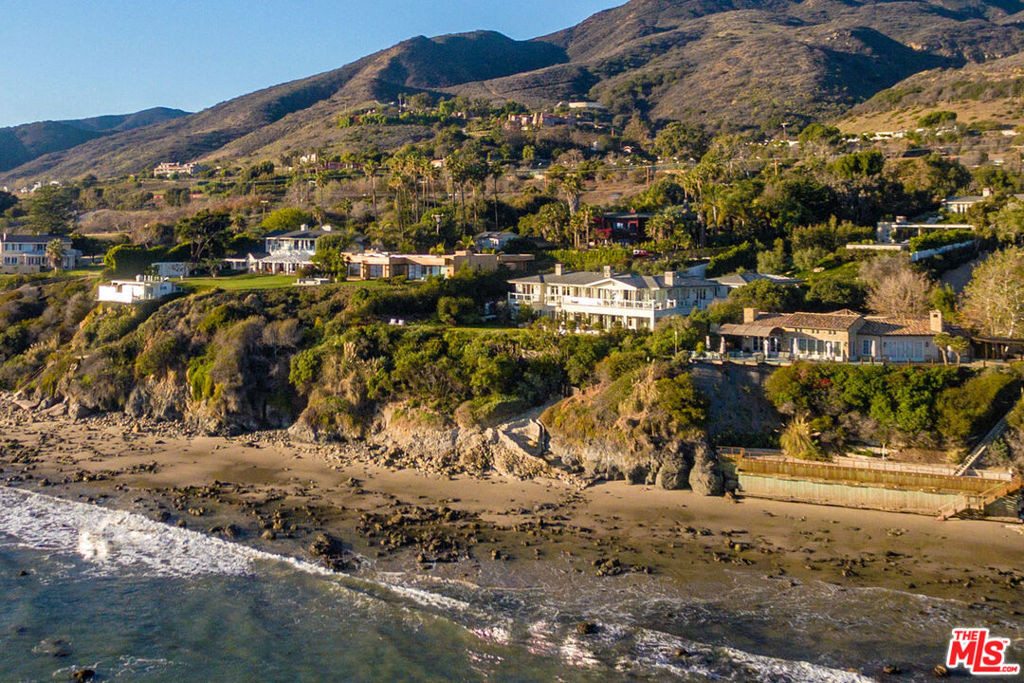 A gated and private bluff-top retreat designed by renowned architect Doug Burdge AIA w/panoramic ocean views, 6bd/7.5ba 2-story Cape Cod home and separate 1bd/1ba GH has deeded beach rights to secluded cove below. On approx 1.72 acres, the sun-filled main house is a superb blend of understated elegance & impeccable craftsmanship w/oak plank floors & custom French doors throughout, featuring a 1st-floor great room w/fireplace & stunning built-in cabinetry. Adjacent is a beautiful stone-finished gourmet island kitchen w/banquette, formal dining room, elevator, bedroom, and office. The 2nd level offers a luxurious ocean view owner's suite w/fireplace, wraparound oceanfront deck, and dual closets and spa-like baths. An entertainer's dream, the resort-style grounds include a covered open-air pavilion w/fireplace, al fresco kitchen w/pizza oven, grill & 2-stone-crafted bars that flow to a 70'x25' ocean view pool w/spa, sunken lounge area, pool bath, & fire pit. Available for lease at $275,000 per month.