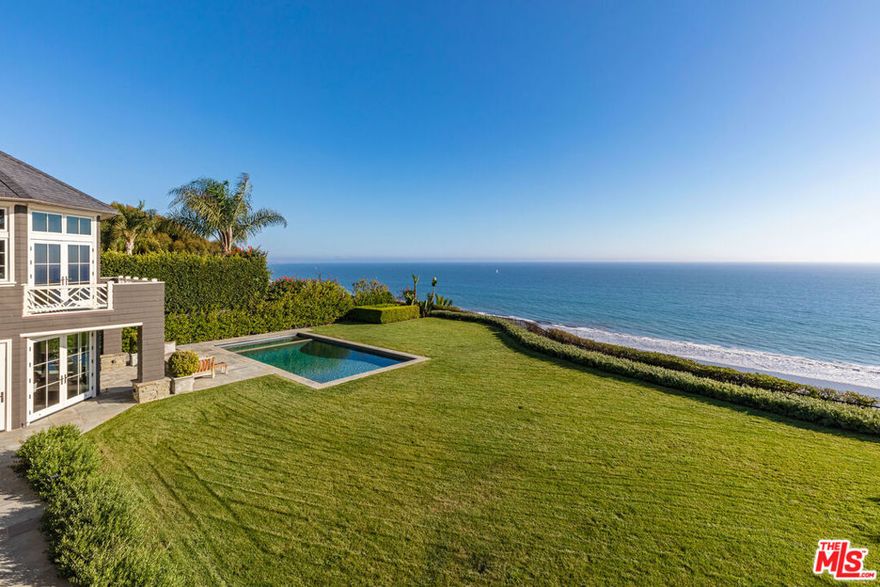 By far one of the most important offerings to become available in decades. The finest location on the Westside. Sited on a 31,861sqft lot with 102ft frontage overlooking the Pacific Ocean: 1 of only 12 properties on the Front Row. Offering unparalleled views spanning the Queens Necklace to Point Dume, the setting is beyond compare. Nantucket-style traditional is iconic in every way. Custom designed and completed in 2009. Classic design features abound, open floor plan embraces the major views and grounds. Elegant public rooms include gracious entry foyer, formal living room with fireplace and intimate dining room. Gourmet kitchen extends to a generous family room and breakfast room. Upstairs the exquisite primary bedroom suite features panoramic views and a marble clad bathroom. 4 additional bedrooms are ideal for children and guests. Additional features include: wood paneled vaulted library, lower level billiard room with wine cellar, third floor contains staff bedroom w/ bath and teen game room or a perfect space for exercise studio. The grounds are lush and verdant with flat grassy yard, incredible pool and spa. Set behind gates for privacy. Impossible to duplicate, a gem that will be cherished for generations to come.