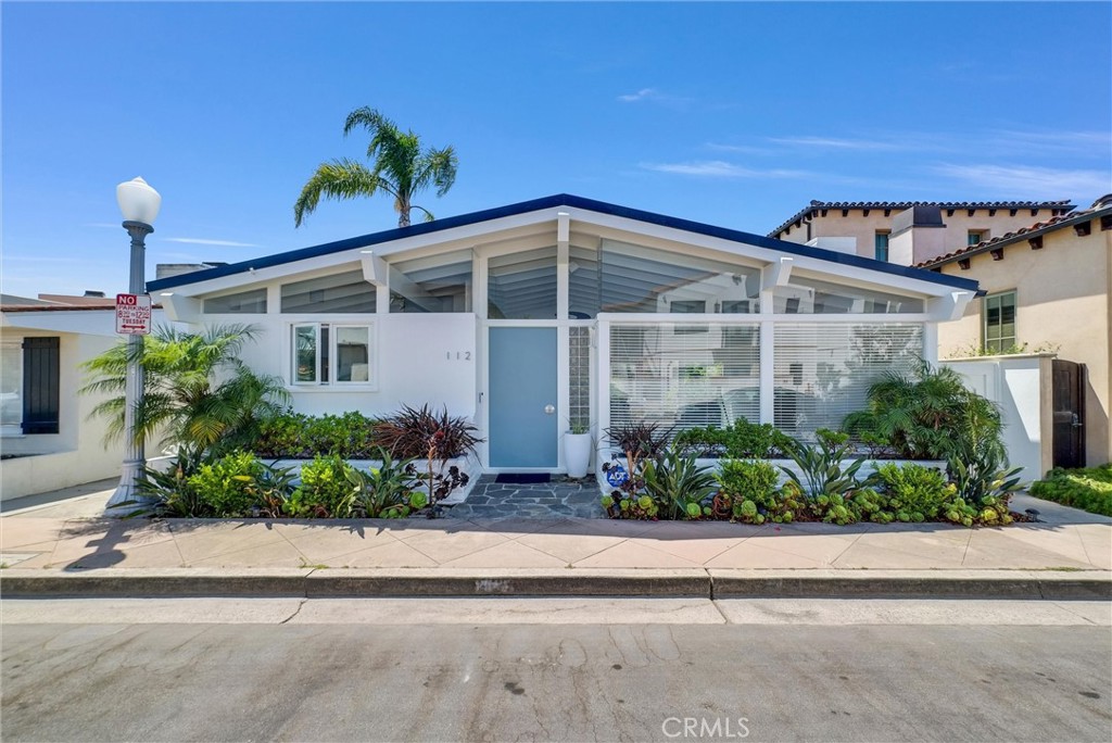 Welcome to 112 Via Florence, a beautifully furnished escape in the exclusive Lido Isle community, just a short walk from breathtaking Newport Harbor. This stylish and sophisticated home offers an ideal blend of coastal living and modern comfort, ready for you to move in and enjoy. The residence features an open, light-filled layout with soaring vaulted ceilings and large windows that create a sense of space and serenity. The living room, with its cozy fireplace, seamlessly flows into the dining area, making it perfect for relaxing and entertaining. The modern kitchen is fully equipped with sleek white cabinetry, high-end stainless-steel appliances, and ample counter space for preparing meals. This home boasts well-appointed bedrooms, including a tranquil primary suite with vaulted ceilings, serene décor, plenty of natural light and a beautiful primary bathroom with soaking tub and separate shower. Both bathrooms are thoughtfully designed with modern fixtures and luxurious finishes. Beyond the home’s impeccable interior, Lido Isle offers an unbeatable lifestyle. Just steps from your door, you’ll find the community’s private beach, tennis courts, and clubhouse. Enjoy a leisurely stroll along the picturesque Newport Harbor or indulge in the many activities that make this area so desirable. Whether you're seeking a temporary escape or a longer-term stay, 112 Via Florence is a fully furnished retreat experience that brings together the best of coastal elegance and modern living. Come experience the finest in Newport Beach coastal living.