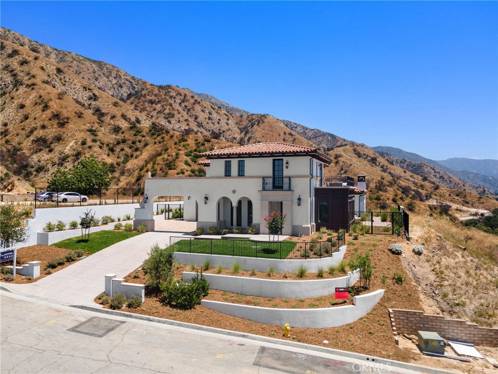 Introducing a Timeless Masterpiece in Sierra Madre
Perched atop the coveted north hillside of Sierra Madre—an area untouched by new development for decades—this newly constructed custom Spanish-style estate presents a once-in-a-lifetime opportunity. Cradled beneath the majestic presence of Mt. Wilson, the residence blends classic elegance with modern sophistication, setting a new standard in luxury living.
Born from Personal Vision and Passion
This home was built not for the market—but for the heart. Designed by the owner as their own sanctuary, every line, every material choice, and every finish reflects an uncompromising commitment to quality and comfort. No expense was spared, and no detail overlooked. From foundation to flourish, it stands as a testament to the builders dream design.
Panoramic Views. Impeccable Details
Enjoy stunning 360-degree vistas of the entire San Gabriel Valley—each sunset more breathtaking than the last. The interior showcases curated finishes: imported Italian marble countertops, artisan lighting fixtures, wide-plank hardwood flooring, and top-tier Thermador appliances. Amenities include a private elevator, built-in surround sound, centralized vacuum system, and integrated smart home technology—allowing seamless control of lighting, climate, and security from your phone or voice assistant.
Luxury Redefined
Every bathroom is outfitted with premium TOTO toilets, including electric bidets and seat warmers for ultimate comfort. A state-of-the-art water filtration system ensures purity throughout the home.
Endless Possibilities
Step outside and envision a future of serene indulgence: a city-approved infinity pool is ready to be built—perfectly framing this elevated retreat for leisure or elegant entertaining.
