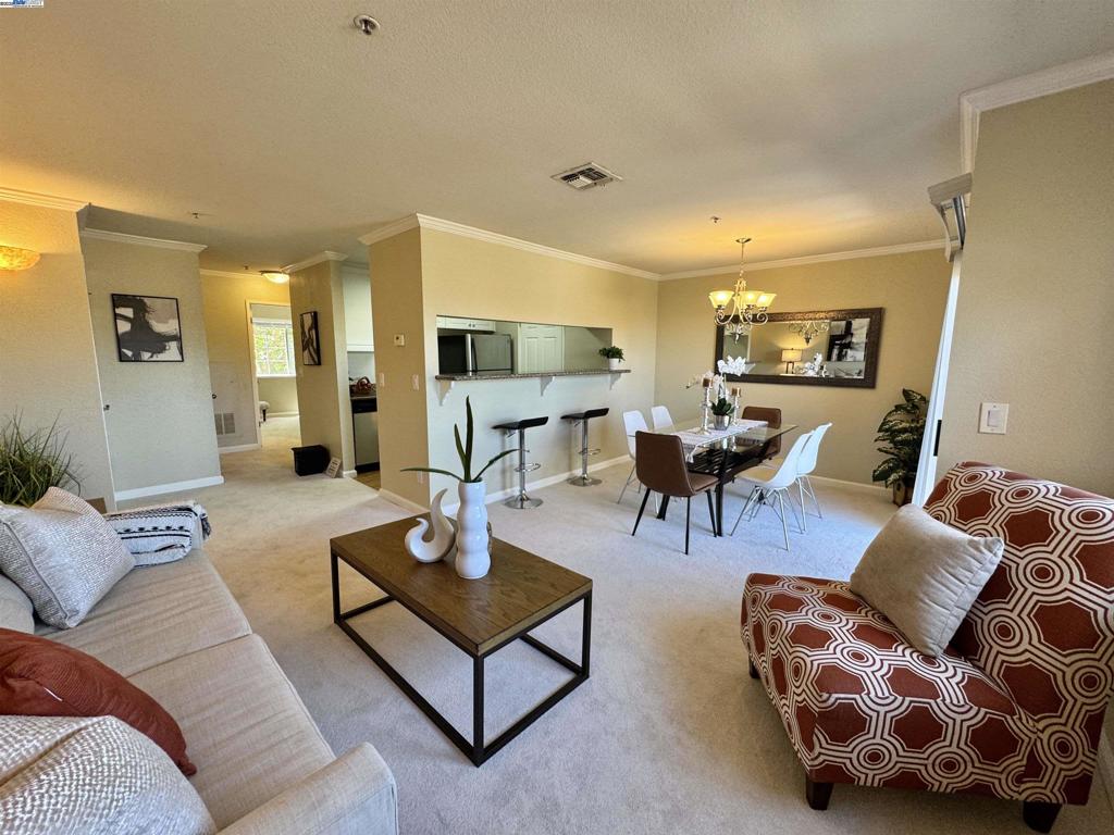 This immaculate top-floor condominium offers a peaceful retreat with stunning views of the surrounding open-space hills. The unit features a spacious layout with a bright and airy living area, enhanced by double sliding glass doors that fill the home with natural light. A private balcony provides extra storage and a perfect spot to relax and enjoy the serene setting. The residence includes an in-unit laundry room for added convenience, and the bedroom is appointed with expansive mirrored wardrobe closets. Ideally located just minutes from The Lot City Center, Bishop Ranch, renowned dining and shopping destinations including Trader Joe’s, Whole Foods, and Costco. Nearby amenities also include walking trails, parks, golf courses, and highly acclaimed schools within the San Ramon Valley Unified School District. Residents enjoy access to a well-maintained community offering desirable amenities such as a swimming pool, spa, fitness center, and BBQ area. Water and garbage services are included in the HOA dues. The unit comes with one assigned carport parking space, and notably, there are no rental restrictions—making this an exceptional opportunity for both personal residence and investment.