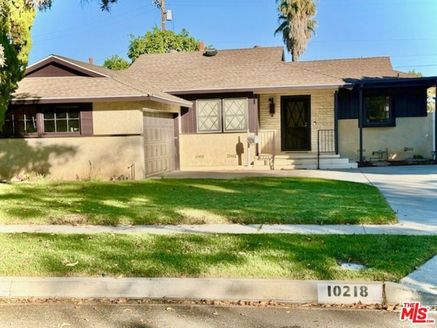 First time on the Market! This home is situated in Granada Hills. Bring your Olympic swimmers! This beautiful 3-bedroom, 1.5-bath home features an impressive 18x41 sparkling pool (replastered last year w/2 drains). Also, elegant lion fountain heads and a cascading waterfall effect perfect for relaxing or entertaining. Inside, enjoy year-round comfort with central air and heat. The spacious kitchen shines with a bay window, double oven, stovetop, dishwasher, breakfast bar, and decorative tile countertops accented by oak cabinetry ideal for both everyday living and special gatherings. Step outside to your private retreat! The new patio roof offers shaded comfort and makes future expansion a breeze. The backyard also features a custom tiled table and benches that beautifully match the pool's design, plus a fruit-bearing grapefruit tree for a fresh touch of nature. Easy access to the 405, 5 and 118 Fwy's. Don't miss this rare opportunity to own a home that combines comfort, charm, and classic Granada Hills character!