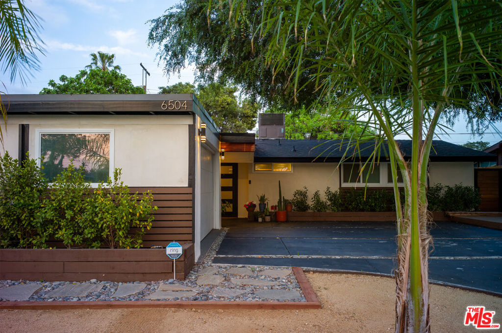 Welcome to a timeless example of Midcentury Modern design featuring a very private backyard oasis! A true gem designed by the renowned Palmer & Krisel - one of the most prolific architectural firms of the 20th century - is ready for you to call it home. With signature vaulted wood-beamed ceilings, angular clerestory windows, clean lines and walls of natural light, this remarkable 4-bedroom, 2-bathroom home embodies the timeless spirit of Southern California living. From the moment you arrive at the curb you will know, without question, this is a home where excellent design is paramount. A sleek, black concrete driveway with stone borders is perfectly complemented by drought tolerant landscaping in the front yard. The next thing to catch your eye as you approach the house are the wood slats adorning the home's exterior, a feature that honors the design language of the home's iconic roots. Stepping inside, a spacious, open-concept living area anchored by midcentury elements is elevated with modern upgrades like recessed lighting and sophisticated finishes. The innate comfort of this design stems from the volume within the space, the abundant natural light and its highly functional layout. In the kitchen, beside the gleaming surfaces you'll find stainless steel KitchenAid appliances and a pass-through breakfast bar. And situated between the kitchen and garage is a thoughtfully designed laundry/pantry/mudroom, offering the highest level of utility and design. Fitting four bedrooms into a 1200 sf house is an accomplishment and it's all the more remarkable given the fact that they're comfortably sized and there are also 2 bathrooms. Speaking of which, both bathrooms features a spa-worthy rain shower, which you'll look forward to using every day. Other modern comforts include eco-conscious upgrades like dual pane windows, tankless water heater, and a newer HVAC. Finally, the back yard is the icing on the SoCal lifestyle cake. Picture yourself unwinding under a golden sun just steps away from the cool sparkle of a pool - perfect for quiet mornings or starlit swims. Surrounding the pool is custom, stamped concrete with ample space for lounging, playing, or entertaining - all of which will take place in quiet seclusion thanks to a tall cedar fence on all sides of the yard. This is more than just a home - it's a quintessential piece of LA's architectural history, beautifully reimagined for modern life.