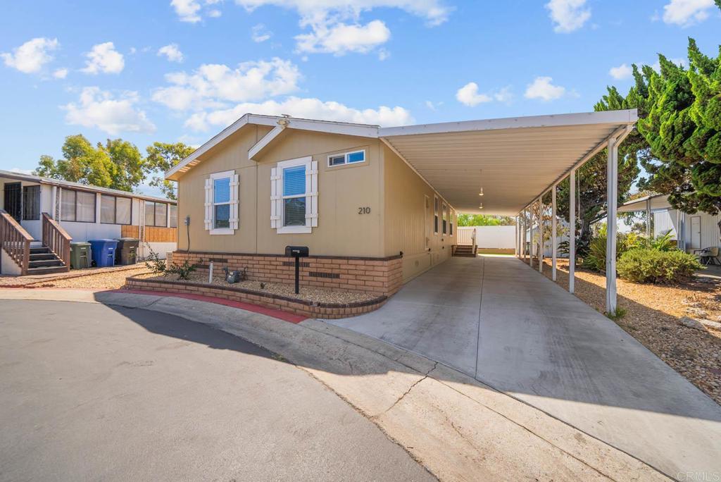Welcome to this stunning 2019 manufactured home offering modern comfort and convenience! Featuring 3 spacious bedrooms and 2 bathrooms, this home boasts an open-concept floor plan with high ceilings and plenty of natural light. Enjoy stylish finishes throughout, including quartz countertops, modern cabinets, stainless steel appliances, and vinyl flooring with fresh interior paint. The double-pane windows, central A/C, and heating ensure year-round comfort. A laundry room with washer and dryer adds everyday convenience. Step outside to your private fenced backyard with low-maintenance artificial grass, perfect for relaxing or entertaining. Parking is available for 2 vehicles, and the community is pet-friendly (with some restrictions). Located in an ALL-AGES gated community, you’ll have access to a sparkling pool, clubhouse, and more. Conveniently situated near the 94 freeway, downtown, major stores, and restaurants, this home offers the perfect balance of comfort and accessibility. Don’t miss the opportunity to own this move-in ready home in a prime location!