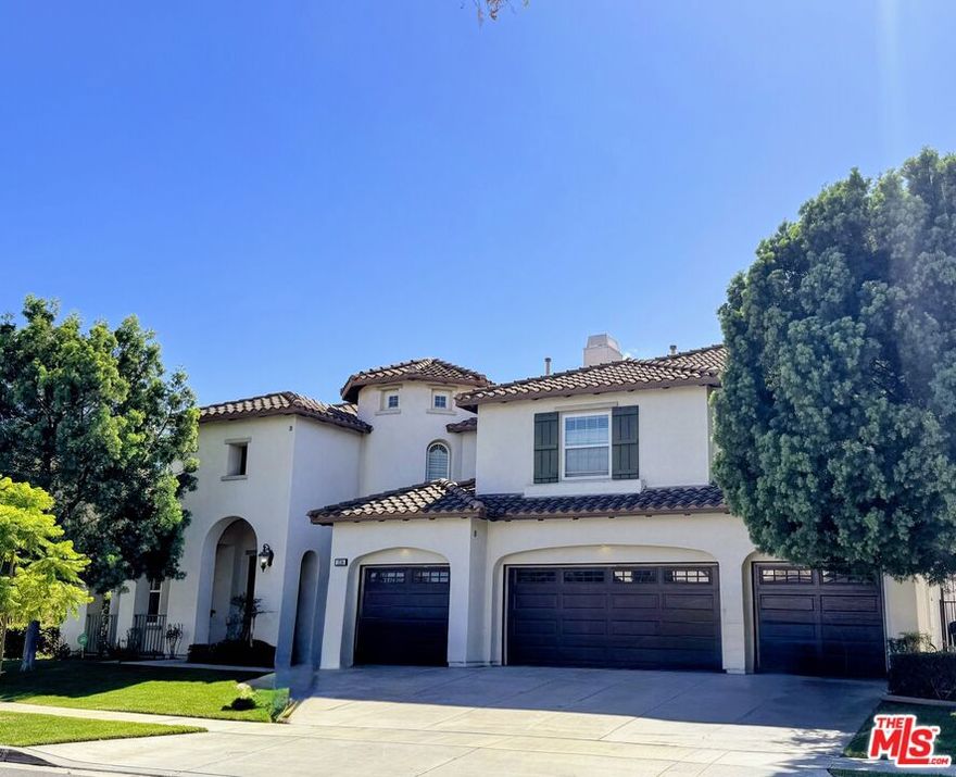Honey, Stop the Car! This massive 5 bedroom, 5.5 bath home welcomes you with a grand foyer and dual staircases. The main level features a formal living room, formal dining room, private office, spacious family room, and a convenient downstairs bedroom with its own bath. The gourmet kitchen is an entertainer's delight, offering granite countertops, a large island, walk-in pantry, stainless steel appliances, cherry cabinetry, and a semi-custom refrigerator. Moving upstairs, there is a large loft/flex space ideal for work, study, or play, along with a luxurious master retreat complete with its own fireplace and private study. The spa-inspired master bath showcases dual vanities, his and hers closets, granite countertops, marble floors, and dual shower heads. Every bedroom is complete with a walk-in closet. The open floor plan is elevated with elegant crown molding. Outside, enjoy plenty of parking and a generous backyard with endless possibilities including ample space for a pool and the opportunity to create your own private oasis. Situated in a picturesque neighborhood with no HOA and within a highly sought-after school district, this home is close to Santiago High School, Centennial High School, and El Cerrito Middle School, as well as shopping and dining. With just a little imagination and personal touch, this will truly become your dream home. Welcome Home!