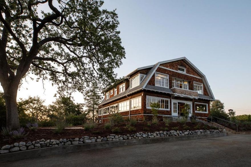 Circa 1900's Dutch Colonial on over 2 acres with views to the western and East Bay hills. Only 1/2 mile from Downtown Los Altos. Approx. 5,152 sf of living space. 6 bedrooms and 3 baths plus an office. The original character of the home has been lovingly preserved w/hardwood floors, period pendant and sconce lighting throughout, crystal knobs and beveled glass french doors. The main level includes the wrap around porch, living room and formal dining room. bedroom, bath and office. The wood staircase leads to the additional 5 bedrooms. Spacious upstairs primary bedroom suite has sweeping views to the western and East Bay hills, the en suite bath is finished with decorative tiles from Italy and has a hand-painted clawfoot tub Two bedrooms, one with its own enclosed porch, sconce lights plus pendant light, and walk-in closet; the second bedroom has sconce lights and East Bay hills views; each bedroom has direct access to a shared bath with a dual-sink tiled vanity and glass-enclosed tiled shower. Two additional bedrooms have vintage pendant lights and a closet, and one features additional built-in drawers The upstairs enclosed front porch lined with windows plus true-divided-light glass doors to an open balcony. Excellent Los Altos Schools!