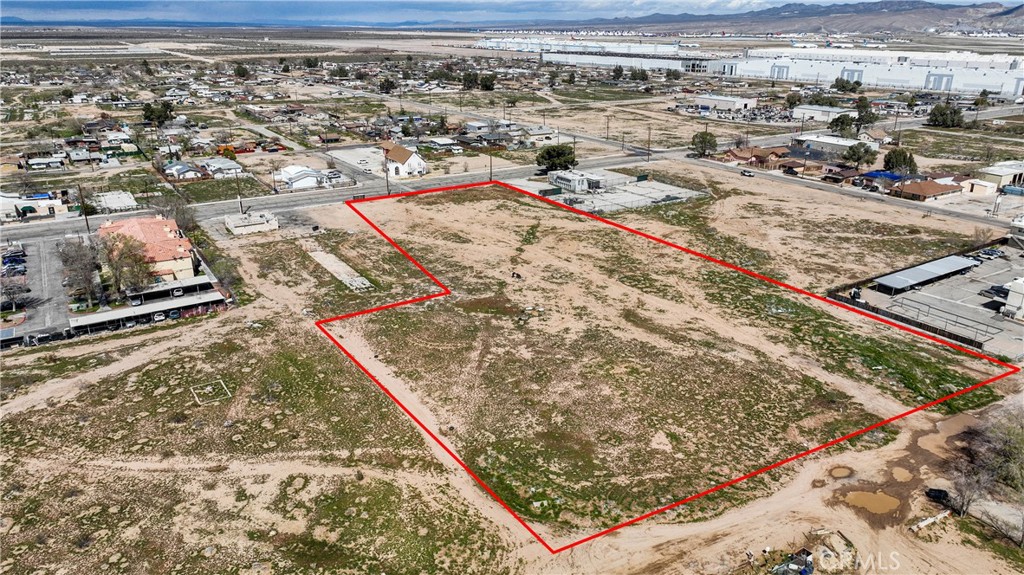 This large commercial parcel is zoned Business Park, allowing for multiple development opportunities, ranging from retail establishments to a gas station. Located in an Opportunity Zone, just up the street from the Southern California Logistical Airport. Buy and develop now, or hold for possible future appreciation. Buyer to do their own due diligence.