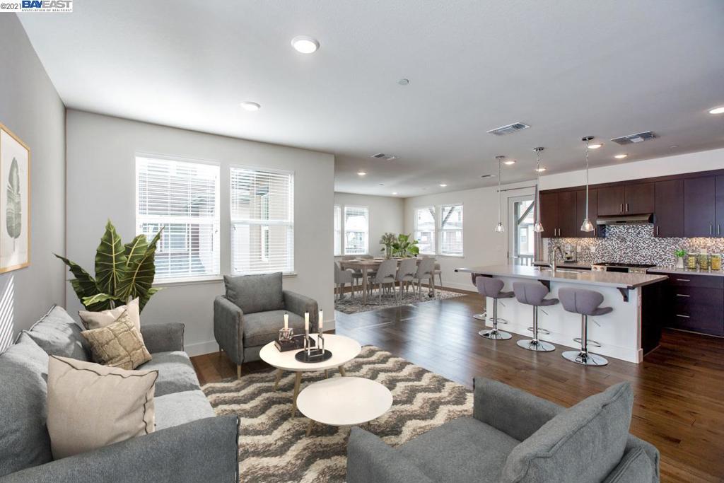 With easy access to SF and Oakland, this luxury Plan 4 townhome-style condo at Symmetry at Alameda Landing HOA was built in 2017 & is full of builder upgrades & beautiful finishes. This spacious, 3-story residence offers a flowing, thoughtfully designed floor plan that includes 3BR, 2.5BA, an open family/kitchen/DR great room w/plenty of windows for abundant natural light, a 1st floor flex space (presently used as a home office), a laundry room, expansive balcony & a 2-car garage. Finishes/details include 9-ft ceilings, hardwood floors, quartz kitchen/bathroom counters, SS Bosch appliances, energy-efficient dual-pane windows, central AC & and integrated interior sprinklers. Located on a non-thoroughfare street around the corner from a complimentary BART shuttle & the dining/shops at Alameda Landing, the home offers easy access to Spirits Alley, the SF Ferry, Posey/Webster Tube & freeways. This sophisticated, turnkey residence offers a contemporary Alameda lifestyle at its very best!