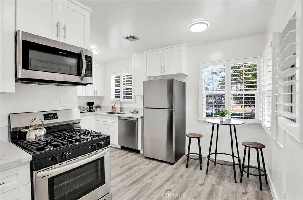 Welcome to Gilmore Grove in Reseda, a beautifully updated 4-bedroom, 2-bath single-family residence with excellent curb appeal and a seamless blend of modern design and convenience. The open layout is enhanced by natural light, highlighting spacious interiors, clean finishes, and a fully equipped kitchen ideal for both daily living and entertaining. The bedrooms are generously sized, offering versatility for a home office, guest suite, or growing household. Outside, the private backyard provides a serene setting with mature fruit trees including oranges, lemons, and peaches, creating the perfect space for gatherings or quiet moments. Additional features include a private two-car garage, in-unit washer and dryer, and thoughtful upgrades throughout. Ideally located in Reseda, this home offers easy access to shopping, dining, schools, and major freeways, keeping you connected to everything Los Angeles has to offer. Move-in ready and available now, Gilmore Grove is prepared for its next chapter.