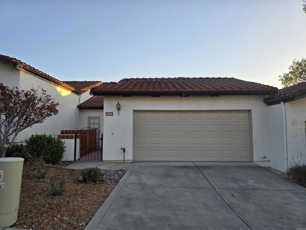 This beautifully updated unit offers a desirable layout with the primary bedroom and bathroom conveniently located on the main level. Enjoy breathtaking mountains and city views from your private balcony, creating a perfect setting for relaxation or entertaining guests. The home features a new roof and stylish vinyl plank flooring throughout, complemented by freshly painted walls. The main floor includes a spacious living room with a cozy fireplace, a primary suite with a walk-in closet, and an updated bathroom with newer sinks. The kitchen is equipped with modern stainless-steel appliances, including a refrigerator, stove/oven, microwave, and washer/dryer. An oversized two-car garage provides ample room for vehicles and additional storage, with laundry facilities included. The lower level features two bedrooms and access to the open patio for entertainment or outdoor living. The community offers a quiet neighborhood atmosphere with relatively low HOA dues and is conveniently located near stores such as Walmart and Starbucks, freeway access, and restaurants. Schedule your private showing today to experience all this home has to offer.