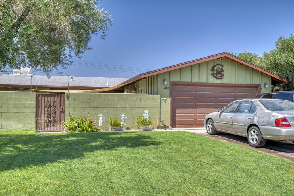Step into a fabulous neighborhood with a welcoming vibe--sidewalks, spacious streets, and a sense of community reminiscent of a simpler time. Close to schools, shopping, and more, this 3-bedroom, 2-bath home comes with thoughtful upgrades, including a newer A/C unit, Roof, and windows. Enter through a private gated courtyard, framed by lush landscaping and beautiful mural--an ideal spot for your morning coffee. Inside, the open kitchen flows directly into the great room, creating a perfect gathering space. Step out to the oversized covered patio featuring a built-in brick charcoal BBQ, and beautifully maintained landscaping with mature citrus trees. Enjoy mountain views and maximum privacy, thanks to newer block wall fencing and surrounding greenery. This is an extraordinary find, ready for a few personal touches to make it truly yours. Don't wait! HOME TO BE SOLD AS IS!!!