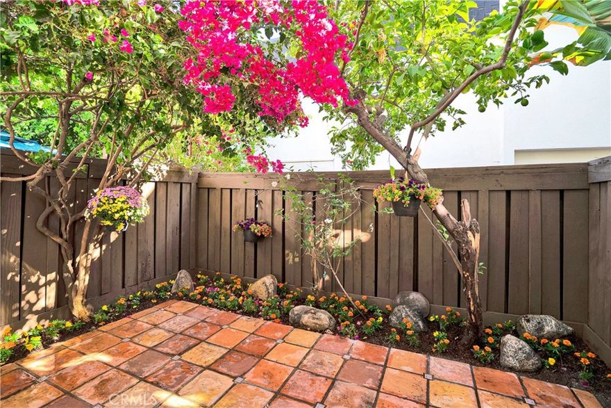 Step into this secure and irresistibly charming, gated townhome, freshly painted and beautifully updated with a new microwave, garbage disposal, electrical outlets, and screen door. A serene private patio—adorned by a lush lemon tree, and vibrant blooms—invites you to unwind, sip your morning coffee, or host intimate gatherings under the stars.

Inside, comfort meets convenience with central AC and heat, in-unit laundry, two assigned parking spaces, private storage, plus five additional community storage areas.

Tucked away in a secluded area with six buildings, this residence offers a rare sense of warmth and connection in the heart of the NoHo Arts District and near Universal Studios—where creativity, culture, and city energy come alive. Stroll to trendy restaurants, lively entertainment, and easy transportation. Just minutes from Warner Bros. Studios and the vibrant weekend farmers’ market.

Pet-friendly and perfectly located, your urban sanctuary awaits.