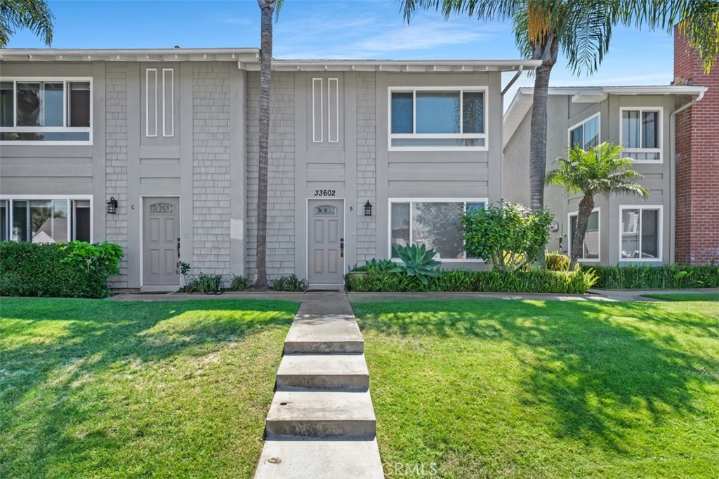 Remodeled and with central AC!! Spacious two story town home 2 bedrooms and 1 bath. The lower level is a great room with dining area and and it opens up to enclosed patio. The new gourmet kitchen is ready to serve! Beautiful hardwood floors throughout! Water, trash, and gardener included. Washer/dryer is available in coin up laundry room. Tandem parking designated spots. Walk to town, restaurants , shops and Dana Point Harbor!