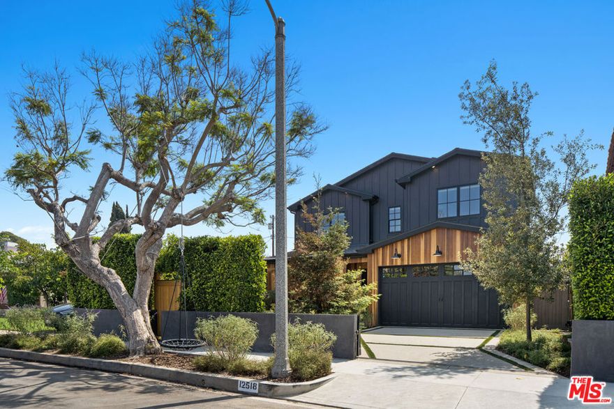 Built in 2020, this 5-bedroom, 5-bathroom residence perfectly blends modern elegance, functionality, and comfort in one of the Westside's most desirable neighborhoods. From the moment you arrive, you're welcomed by a manicured front garden, custom wood entry gate, privacy hedges, and secure gates that frame the home beautifully. A peaceful walkway through the landscaped garden leads to your front door, setting the tone for the serene lifestyle inside. Step inside to an expansive open layout filled with natural light from curated windows throughout. The downstairs bedroom has been transformed into a glass-walled office, creating a bright, inspiring space to work. The living room is anchored by custom built-ins and opens through large bifold doors to a backyard designed for California living. The chef's kitchen is a showstopper, featuring Thermador appliances, a walk-in pantry, butler's area with coffee station, and abundant storage to create an entertainer's dream. Outside, the backyard boasts a 26' x 14' swimming pool with spa, a sleek deck, multiple fire pit areas, and a full outdoor BBQ station. Owned solar panels add energy efficiency and utility savings and include a battery backup that will allow you to live off the grid for over 24 hours, find two spacious en suite guest bedrooms and the luxurious primary suite complete with a huge walk-in closet and spa-quality bath. This home offers the perfect balance of modern sophistication and family-friendly warmth, all in the heart of North Mar Vista.