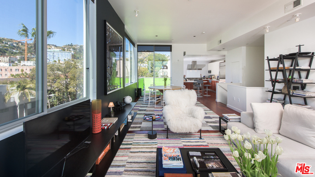 Stunning townhouse-style Penthouse with spectacular views and no common walls, located in prime West Hollywood. This immaculate 3-bedroom, 2.5 bathroom residence is designed like a stand-alone home with no common walls and a dramatic modern design. Interiors feature an inviting open plan with high ceilings and incredible natural light, a large, private balcony and walls of glass highlighting panoramic views of the Hollywood Hills and Sunset Strip. The chef's kitchen also includes unobstructed views, as well stainless appliances and an eat-in bar. Retreat downstairs to the luxe master suite and find a walk-in closet, and spa-like bathroom with dual sinks, soaking tub, stall shower, and rich cabinetry. Additional highlights include two guest bedrooms, powder, laundry, dual-zone heating and air, and 2 secured parking spaces. Enjoy the best of urban living, a stone's throw from West Hollywood dining, nightlife, and shopping. This will not last, priced for immediate sale!