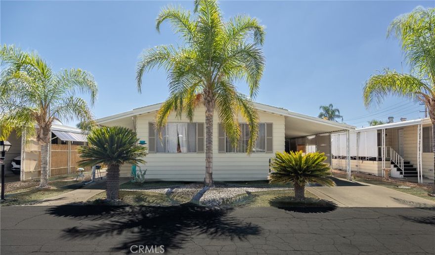 Check out this nice 3 bedroom manufactured home in the gated senior 55+ community of Eden Roc North. Full length porch for you to enjoy your morning coffee or evening breezes. Living room is very welcoming at the front of the home next to one of the guest bedrooms. Kitchen opens up to the family room and next to the dining area with built-in hutch. Primary bedroom located at the rear with its private bathroom. The other guest bedroom has direct access into the guest bathroom by the inside laundry room. Shed & storage cabinets at the end of the carport. Located in an active community right across from the amenities that include clubhouse, pool, spa, exercise & billiards rooms, and many classes & social get togethers scheduled each month. You'll be close to shopping, restaurants & public transportation.