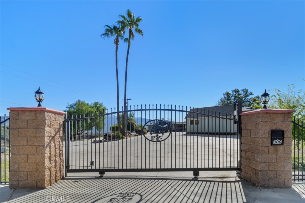 Own your very own an Estate at the Top of the Hill! Stunning Custom Home with Breathtaking Views! Welcome home to this remarkable, highly desirable Ranch Style residence nestled on over 4.5 acres, offering a rare lifestyle surrounded by the natural beauty of San Jacinto Mountains & Hemet Valley. This move-in ready home seamlessly blends comfort, luxury, & functionality, making it an entertainer’s dream & the perfect family sanctuary. Enjoy 4 bedrooms and 2.5 baths, including an oversized primary suite featuring an en-suite bathroom & a cedar-lined walk-in closet with abundant storage, LIGHT AND VIEWS. There is pleanty of room if you want your own CHICKENS or maybe goats. Expansive Chefs Kitchen boasts double ovens, dual sinks, a gas stovetop, ample cabinets & a walk-in pantry. Ideal for social gatherings. Adjoining dining room & living room invite relaxation & connection.
Discover a backyard oasis complete w/ a gas fireplace & mesmerizing views, perfect for evening entertaining or peaceful gatherings in nature.
A separate entry leads to the fourth bedroom, ideal for use as an office or guest suite, catering to your family's varied needs. Stay comfortable year-round with central heating & air conditioning. The home features energy-efficient solar panels & new roofing, reducing electric costs. Enjoy in movie nights with a built-in home theater system equipped with Dolby Atmos surround sound—a true cinematic experience at home.
This property includes an RV garage with a full hook-up, 50 AMP outlet, & septic access, providing everything you need for your toys. More perks include a whole-house water filtration system and extra storage. Enjoy Piece of Mind & Safety with a private entry, a remote electric gate, & a home security network equipped with surveillance. The beautifully landscaped gardens feature fruit trees & an oversized driveway for ample parking. Front & Rear Patios. The lower-level property is graded for an Accessory Dwelling Unit (ADU), presenting potential for a pool, expansion or rental income.
This exquisite property at 300 Anderson Drive is more than just a home; it’s a lifestyle retreat where every detail has been thoughtfully crafted. Don’t miss this rare opportunity to own a piece of paradise in Cali—where Zippy the Zebra can be your charming neighbor!
Experience the perfect blend of privacy, space, & luxury living—schedule your private tour today and envision a future filled with enchanting moments in this specialresidence!