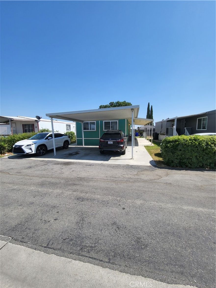 beautiful upgraded and remodeled  double wide mobile home. Perfect home for that starter family. Home is beautifully designed with upgraded Grey laminate flooring throughout, fantastic new modern kitchen with sparkly quartz counter tops, real glass tile back splashes, Grey shaker cabinets with plenty of room for storage.. very large living areas, large living room, perfect dining room, and huge master bedroom. Kid s room is perfect for 2 twin beds if needed. Bathrooms are elegantly remodeled with favorable 12x24 ceramic tile floors, big granite vanities and master bath has elegant white and very subway tiles for one's enjoyment. Need to cool down for the summer, each room has split systems for heat and cooling. Last but not least the back yard has more than enough room for that big family and kids to celebrate holidays or birthdays. Come see your future new home. Also park had a swimming pool for summer play, it's a family park for your children to make life long friends.