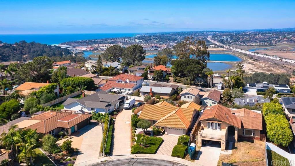 TOP OF THE HILL CHARMER! First Time on the Market for Sale in 37 years, this lovely Single-Story Mediterranean-Style Home is perched at the Highest Elevation Point in Del Mar Hills, west of the I-5 with views of the San Dieguito River Valley and beyond. Set on a quiet street in one of Del Mar’s most desirable neighborhoods, this residence is light and bright and sunny with large picture windows, clean white walls and luxury vinyl flooring flowing seamlessly throughout. From the moment you arrive, the fully paved exterior, including the front yard, expansive driveway, and private backyard, showcases a distinctive custom paver pattern that elevates the home’s curb appeal and provides effortless indoor-outdoor living. The classic clay tile roof adds to the authentic Mediterranean charm, while the low-maintenance landscaping ensures beauty with ease of care. Inside, you’ll find 3 spacious bedrooms and 2 beautifully updated bathrooms. A cozy brick fireplace anchors the living area, while the sizable family/bonus room provides the perfect spot to relax or entertain — all while soaking in views of the lush backyard and surrounding valley. The dedicated dining room is perfect for gatherings, and the thoughtfully designed kitchen opens effortlessly into the main living spaces. Step outside to a low-maintenance yard filled with mature, drought-tolerant landscaping, a fruitful lemon tree, a fig tree, and ample room to garden or unwind. A large, detached shed provides valuable extra storage or the potential for a creative studio or workshop. Whether you're enjoying peaceful mornings on the patio or hosting guests under the stars, this property offers a rare blend of beauty, privacy, and easy living, all just 8 minutes from Powerhouse Beach and downtown Del Mar. Del Mar is one of Southern California’s most sought-after coastal communities; known for its natural beauty, relaxed elegance, and vibrant lifestyle. It is famous for its pristine beaches, dramatic ocean bluffs, and breathtaking sunsets. At the heart of the city, Del Mar Village offers a unique mix of boutique shops, gourmet restaurants, art galleries, and quaint cafés; all just steps from the ocean. It’s a walkable, welcoming area that captures the community’s coastal charm. Del Mar is also home to the World-Renowned Del Mar Racetrack and Fairgrounds, and the city hosts the annual San Diego County Fair and thoroughbred horse racing season which bring energy and excitement to the area each year. With the mild climate year-round, home owners can also enjoy miles of scenic walking, biking trails, and nature preserves like the nearby Torrey Pines State Reserve, and proximity to the San Dieguito Lagoon and River Park trails. Families are also drawn to Del Mar for its award-winning public schools, including those in the Del Mar Union School District. Key Features of this home are: • Highest elevation point in Del Mar Hills, west of I-5 • 3 bedrooms, 2 bathrooms, Single-story layout • Mediterranean architecture with clay tile roof • Entire exterior paved in unique custom paver design • Luxury vinyl flooring throughout • Brick fireplace in living area • Family/bonus room with sweeping backyard and valley views • Large backyard with mature landscaping, lemon & fig trees • Detached shed for storage, studio, or workshop use • Low-maintenance yard with drought-tolerant plants • Expansive views of the San Dieguito River Valley This home is a true gem with style, space, and scenery; don’t miss the opportunity to make this your next home! ________________________________________