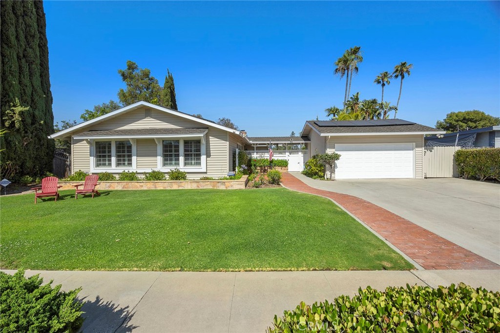 Summertime and the living is easy – California dreaming is alive and well in this pristine Golden Hills SINGLE STORY view home sitting above the famed Fullerton Bridle Trail, complete with a salt water pool and spa, 4 hole putting green and expansive covered patio PLUS OWNED 9.2kW solar system! Do you dream of a home that will make entertaining a breeze and be ‘the’ home your friends and family want to come to, welcome home to 1016 N. Highland Avenue. Classic ranch style architecture is perfectly complimented by a manicured lawn, handsome rock planters and a Presidential shingle roof. Entering the courtyard you are immediately welcomed to a resort style backyard and a flagstone porch leading to the front door. An open concept and welcoming interior awaits with gleaming hardwood floors and a stunning remodeled kitchen. The living room features dual sliding doors, one of two gas fireplaces and crown molding. Pool and backyard views are highlights of the space. Wait until you see this kitchen: it’s the true core of the home; custom built white cabinetry, quartz counters, tile flooring and a full suite of top-end appliances including integrated refrigerator with custom matching cabinet fronts, dual Dacor convection ovens, Dacor 5 burner gas cooktop and ceiling recessed exhaust vent hood. Multiple windows and a porcelain farmhouse sink blend to create a welcoming feeling. The dining nook completes the kitchen and leads you to the generously sized family room addition complete with beamed ceilings, gas fireplace, ductless AC unit and multiple windows provide park and distant hill views. A convenient ½ bathroom/laundry room (washer and dryer are included) completes this wing of the home. Down the main hallway three comfortably sized secondary bedrooms and remodeled hall bathroom with floating vanity with underlighting, and custom tiled bathtub surround with frameless glass enclosure await. The primary suite features dual closets, hardwood flooring and a remodeled en-suite bathroom with custom vanity, tile shower and upgraded fixtures. Expansive paver patio areas surround the remodeled salt water pool and spa with fountain feature and pebble tech finish plus a covered patio. All of these amazing amenities overlook Hillcrest Park with Santiago Peak in the distance, providing amazing sunrises and ‘moonrises’ – The 2 car detached garage has its own sub-panel. A detailed list of amenities & inclusions are found in the media section. Don't miss this special home!