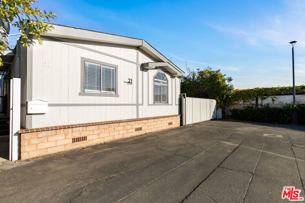 Welcome to this charming 1991 manufactured home in the highly sought-after Hollywood Backlot Bungalows. Featuring 3 bedrooms, 2 bathrooms, and just over 1,000 square feet of modern living space, this home has been thoughtfully updated throughout. Situated on the largest lot in the park, it offers a blank canvas to create your own private oasis. One of the standout features is the exclusive parking available only for this unit. Don't miss out on this rare opportunity to own in this desirable community! Outside, enjoy the sunny California weather and take advantage of the community amenities including a refreshing pool, gym, and clubhouse. With a prime location close to local entertainment, dining, and shopping, this home is a great opportunity to experience the Hollywood lifestyle at its best. Space rent is an affordable $1495.