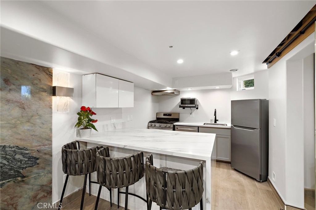 Welcome to your coastal retreat in Laguna Beach, where style meets comfort in this newer ground-level studio. Filled with natural light, the open living space is enhanced by sleek modern finishes that create a polished and inviting atmosphere. The kitchen is appointed with modern appliances, while the bathroom features an elegant walk-in shower that brings a touch of spa-like luxury. Convenient laundry access and ample storage make everyday living effortless. With the added benefit of your own parking space and a prime location just moments from Laguna's beaches, restaurants, galleries, and shops, this studio offers the ideal blend of coastal charm and modern convenience.