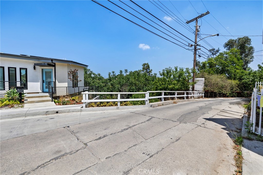 Welcome to 4744 Glenalbyn Dr, a rare opportunity to acquire a 2,666 sq ft parcel in the coveted hills of Mount Washington—one of Northeast LA’s most desirable and rapidly appreciating neighborhoods. Perched on a quiet, scenic street, this lot offers sweeping hillside views and a serene setting surrounded by mature trees and nature. Zoned R1 for single-family residential use, the property is an ideal blank canvas for developers, builders, or end-users looking to bring their architectural vision to life. Utilities and water are available at the site, helping to simplify the development process. This offering includes access to multiple valuable reports that can expedite due diligence and planning, including a topographic survey, arborist report, architectural plans, soil approval letter, and hillside referral form—all available upon request. Enjoy peaceful hillside living with close proximity to the cultural vibrancy of Highland Park, Downtown LA, and nearby freeway access. Mount Washington is highly sought-after for its unique combination of natural beauty, artistic community, and urban convenience. With recent nearby sales supporting strong long-term value, 4744 Glenalbyn Dr represents an exceptional investment or custom-build opportunity in a truly special part of Los Angeles. Don’t miss this chance to secure your place in one of LA’s most inspiring hillside communities.
