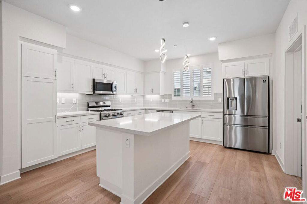 Welcome to 178 South Gardena's highly desirable gated community! Built in 2021, this modern 3-bedroom, 3.5-bath residence offers the perfect combination of style, comfort, and convenience. Inside, you'll find open and inviting living spaces with durable vinyl flooring throughout and custom wood shutters that add a touch of elegance. The chef's kitchen comes fully equipped with all stainless steel appliances included, while thoughtful upgrades such as a Tesla charger and mounted TVs with brackets make this home truly move-in ready. Each bedroom is designed with privacy in mind and features its own en-suite bathroom, plus a convenient powder room for guests. As a resident of the 178 community, you'll enjoy access to resort-style amenities including a pool, spa, playground, dog park, BBQ grills, and more. Ideally located near the 91, 110, and 405 freeways, this home offers an easy commute and has short distance to shops and restaurants, with 85C Bakery, 99 Ranch Market, and Tokyo Central just minutes away. Don't miss the opportunity to own a newer construction home in one of Gardena's most sought-after neighborhoods!