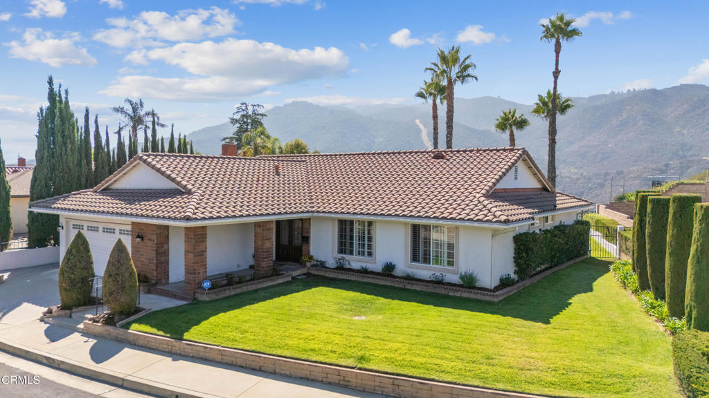Nestled in the highly coveted La Shell/Crystal View pocket of Tujunga, this beautifully updated single-story home offers 1,917 sq ft of elegant living space--larger than most in the tract. The bright, open layout features vaulted ceilings, spacious living and family rooms, hardwood floors, and abundant natural light throughout. The remodeled kitchen shines with granite countertops, custom cabinetry, stainless steel appliances, and a center island--ideal for cooking and entertaining. Enjoy seamless indoor-outdoor living with sliding doors leading to a covered patio and a beautifully landscaped backyard overlooking the stunning Verdugo Mountains. The serene primary suite provides a relaxing retreat with a spa-like ensuite bath. Thoughtful details include energy-efficient solar panels, extensive storage options, built-in cabinets in the garage, and a roomy attic. Conveniently located near parks, hiking trails, and local amenities, this exceptional home blends tranquility, modern comfort, and an unbeatable Tujunga location.