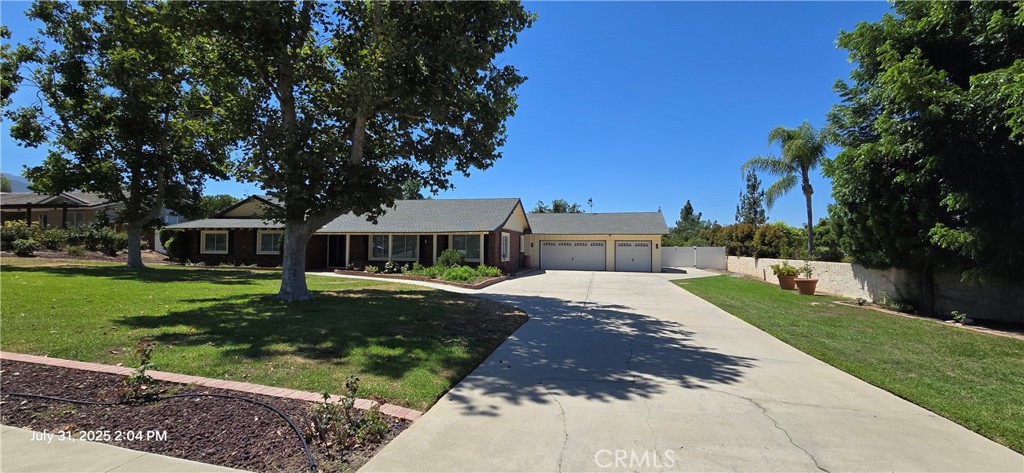 Complete interior remodel just finished in July on this truly amazing & luxurious single story pool home in South Corona! Located on one of THE most desirable streets in the region on a tree lined street and resting on fully usable (.92 acre) 47,074 square foot lot! Open floorplan with upgraded double pane windows, new luxury vinyl flooring, new interior & exterior, paint, recessed lighting, ceiling fans, appliances, & upgraded baseboards throught! Double door entry leads you into the formal living & dining area. Spacious remodeled kitchen with Quartz counters + tile backsplash, custom cabinets w/self closing drawers, stainless steel appliances including the refrigerator & wine cooler! 2nd living room open to the Kitchen w/Limestone fireplace and sliders to the back yard! There are 4 bedrooms and 3 FULL bathrooms! The primary bedroom has custom closet doors, ceiling fan, recessed lighting, and sliders to your private side patio! The primary bathroom has newly installed dual vanities w/light accented mirrors, and a HUGE custom tiled shower with multiple shower heads! The 3 secondary bedrooms are all good size which closets, ceiling fans, & recessed lighting! There are two additional fully remodeled bathrooms both with Quartz counters, and upgraded/custom tiled shower/tub enclosures! Also inside is a spacious indoor laundry room and direct access to your 3 car garage w/new epoxy flooring! The exterior has amazing curb appeal with a sprawling green front lawn w/mature landscaping, and lots of space between neighbors! There's more than enough room to park your RV, boat, trailer, and more! The back yard has a covered patio, firepit area with seating, brand new pool decking + coping, and a newly surfaced swimming pool! Beyond the pool there's your own private orchard with multiple fruit trees, a sports court, and lots of additional room to spread out! ***Landscaping & Pool services is INCLUDED too!***
