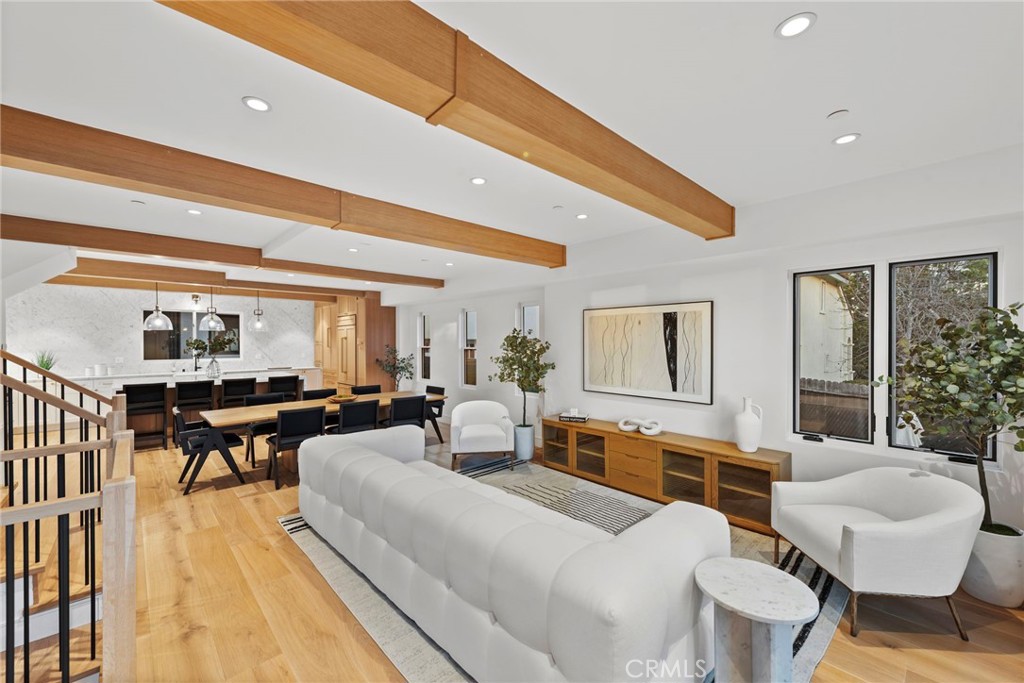 Masterfully designed and built, the Back Bay Townhomes are a collection of extraordinary modern-style homes that boasts an array of features. Primary level hosts the open concept living area that si outfitted with gorgeous wood beams and exquisite finishes. Luxurious European flooring is spread
through the entirety of of the home. The gourmet kitchen holds marble countertops, vast waterfall style island, custom cabinetry, and best-in-class appliances, including Wolf range, Sub-Zero refrigerator, and more. An elegant primary suite with beautifully designed bathroom and walk-in closet constructs the third level along with the two remaining bedrooms. The uppermost level consists of a bonus room perfect for any use. Two rooftop decks add for an enhanced indoor/ outdoor flow, whilst providing views. Additional highlights include tremendous location, two car garage, main level area perfect for home office, stylish hardware throughout, and many more. Completely brand new, this home allows for the comfortable lifestyle of Newport Beach, al while boasting the dazzling aesthetics of modern architecture.