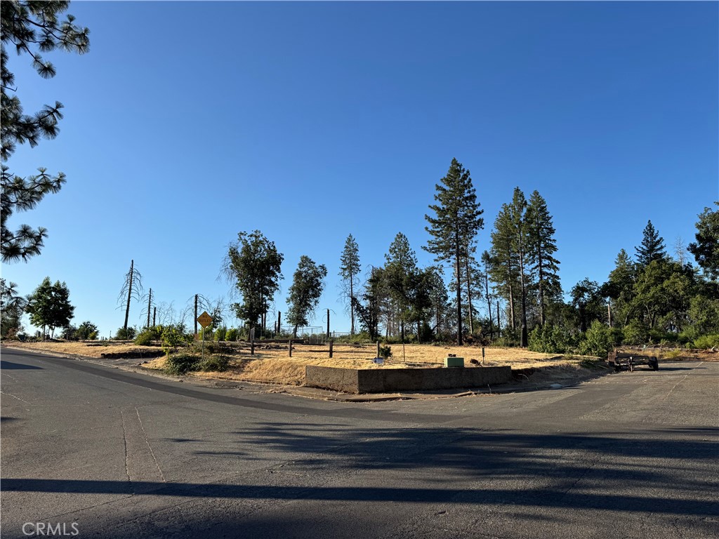 Prime Westside Corner Lot with Pool & Potential! Located in one of Paradise’s most sought-after westside neighborhoods, this corner lot at Crestview and Nottingham offers a rare blend of established charm and future opportunity. Surrounded by beautiful new construction homes, the property also backs up to expansive, undeveloped acreage—providing a peaceful setting. The lot previously hosted a 1,633 sq ft, 3-bedroom home, and building credits are available, offering significant cost savings for your rebuild. An in-ground pool, resurfaced and re-tiled in 2017, still remains and is just waiting to be brought back to life as the centerpiece of your future backyard oasis. The property is active with PID water, and while the septic system is aged, it’s factored into the pricing and offered as-is. Whether you're ready to build your dream home or invest in a highly desirable part of town, this lot checks all the boxes. Run, don’t walk—this is a rare find on the west side of Paradise!