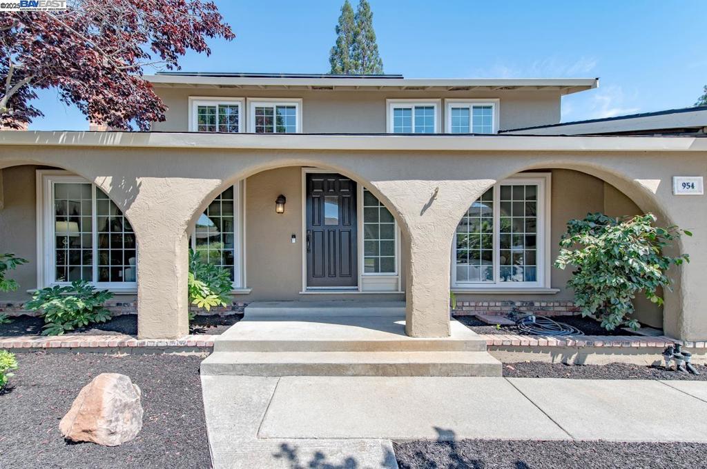 Welcome to Vintage Hills—space, sunshine, and solar! This classic two-story home in one of Pleasanton’s favorite neighborhoods offers a flexible layout, solar panels, and a sunny backyard perfect for relaxing, gardening, and play. A covered front porch welcomes you inside to a bright living room with a cozy fireplace and large picture window. The adjoining dining room overlooks the backyard, while the kitchen and family room include skylights, a casual dining nook, and stainless steel appliances. The main level features a bedroom and full bath with walk-in shower—ideal for guests or multi-generational living. Upstairs, the spacious primary suite offers a stall shower, walk-in closet, and lovely views of Mt. Diablo. Two additional bedrooms with walk-in closets share a bath with shower-over-tub. Quality details include crown molding, recessed lighting, ceiling fans, and baseboards throughout. Outside, enjoy a generous backyard with a wide patio perfect for dining and entertaining, a raised planter box, and an apple and lemon tree. Conveniently located just minutes from Vintage Hills Elementary, local parks, downtown Pleasanton, Livermore wineries, and easy access to highways 580 and 680. Broker's Tour Fri 09/05 10-1p | Open House Sat & Sun 09/06-07 1-4p.