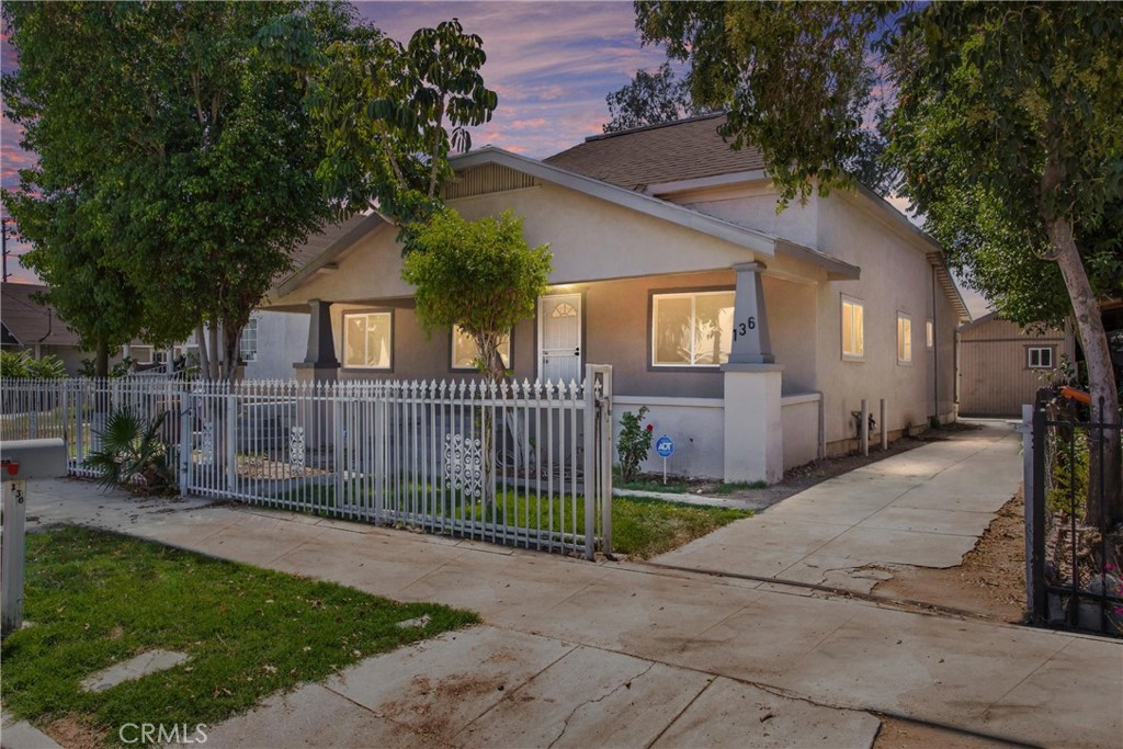 This completely remodeled 6-bedroom, 4-bath property features a 4-bedroom, 3-bath main home along with a detached 2-bedroom, 1-bath studio, making it an excellent option for multigenerational living. Every space has been thoughtfully updated with modern finishes, creating a move-in ready opportunity.
The main home begins with an oversized front porch that leads into two spacious bedrooms positioned at the front of the home. A large living room with high ceilings and a ceiling fan sits at the center and connects seamlessly to the kitchen and dining areas. The remodeled kitchen is equipped with brand new cabinetry, white quartz countertops, stainless steel sink, and stainless appliances including a dishwasher, microwave, and gas range. A dining area just off the kitchen provides direct access to the rear yard. Neutral laminate wood and tile flooring, recessed lighting, and updated finishes extend throughout the home. Toward the back are two additional bedrooms, each with en-suite bathrooms. The primary suite offers a walk-in closet and a large bath with a shower and tub combo. A spacious laundry room and another full bath complete the main home.
The detached studio, with its own private access, adds flexibility for extended family or long-term guests. It includes two bedrooms, a kitchen area with sink and room for a stove, and a shared full bath with a tiled walk-in shower.
The oversized rear yard is a blank canvas with plenty of potential to design outdoor living spaces or gardens and also offers convenient rear access. With its fresh remodel, versatile layout, and multigenerational potential, this home is ready to welcome its new owner! Conveniently located to nearby shopping, schools, and commuter-friendly freeway access.