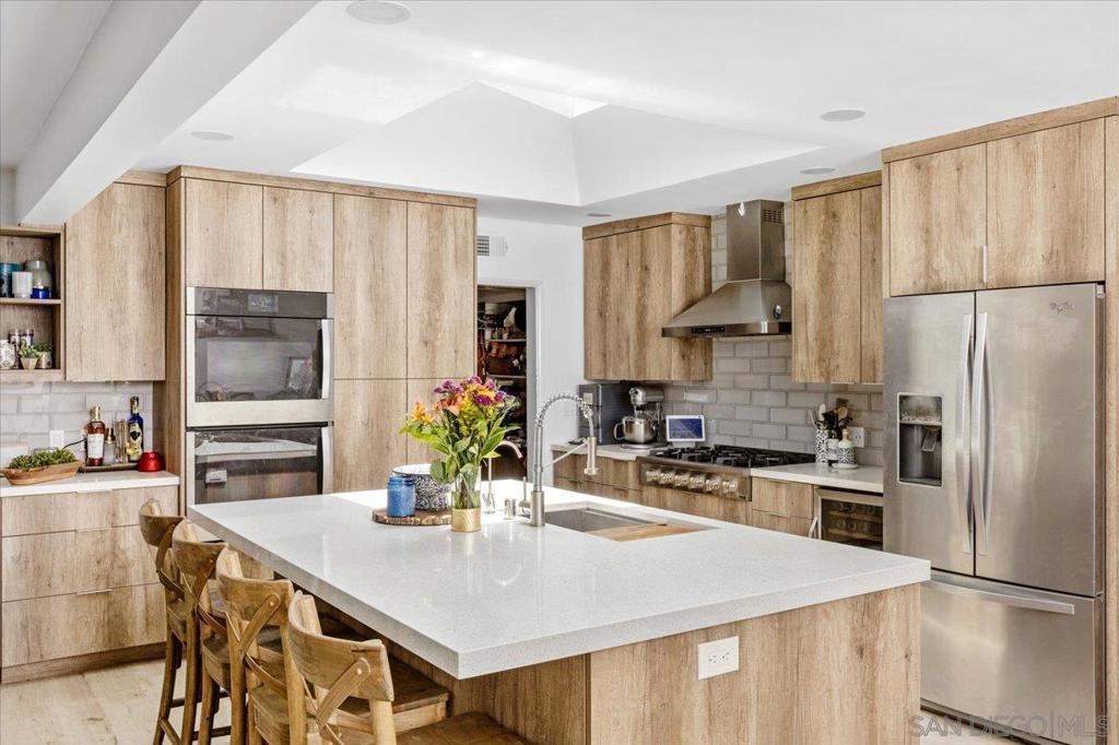 Welcome to your dream home! This beautifully updated 4-bedroom, 3-bath residence offers over 2,300 sq ft of comfortable living space on a spacious and flat nearly ½-acre lot. The custom chef’s kitchen is a standout, featuring a 6-burner range, double oven, wine fridge, and stylish finishe, perfect for entertaining or everyday living. The open-concept kitchen and living room create a bright, airy feel, while a separate family room offers space for a game room, home theater, or additional lounge area. Enjoy updated flooring and modern upgrades that bring both charm and functionality. Step outside to your private oasis, complete with a sparkling pool, RV parking, and a roundabout driveway that provides both convenience and curb appeal. Owned solar keeps energy costs low, and the property is located in a quiet, highly desirable neighborhood with no HOA or Mello Roos. Whether you're hosting guests or relaxing with family, this home offers the perfect blend of space, style, and amenities. Don’t miss this rare opportunity!