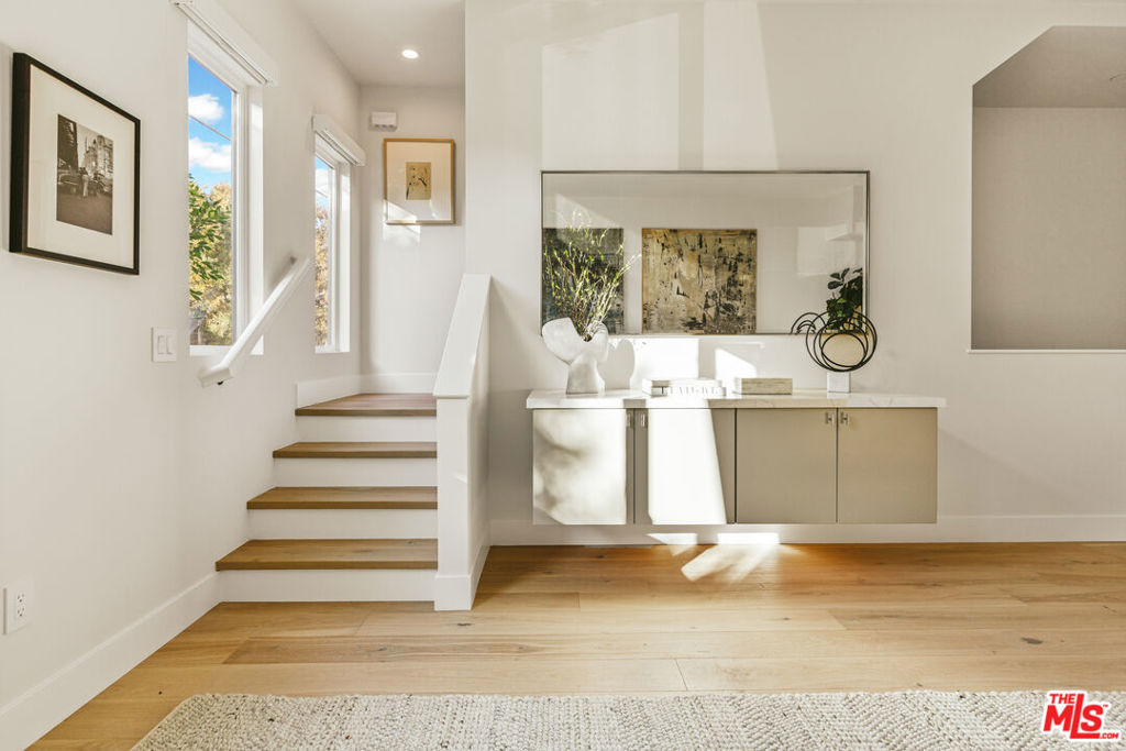 Welcome to the Mar Vista Collection, an exclusive ensemble of one-of-a-kind single family residences in the heart of Mar Vista. This modern single-family home is the embodiment of design within one of the Westside's most coveted neighborhoods. The home features modern-minimalist interiors, inclusive of white oak floors, stone counters, and Thermador appliances. The floor plan prioritizes open living spaces with generously proportioned bedrooms and bathrooms as well as a walk-in primary closet. It comes fully equipped with a spacious rooftop terrace to enjoy stunning city and mountain views as well as private garages with EV charging capability. The community is framed by a six-foot privacy fence on three sides and full height hedging at the front creating a real sense of privacy. This is an opportunity to live in an unparalleled location just moments from the ocean, Whole Foods, award-winning Mar Vista Elementary school, and world-class dining and entertainment.