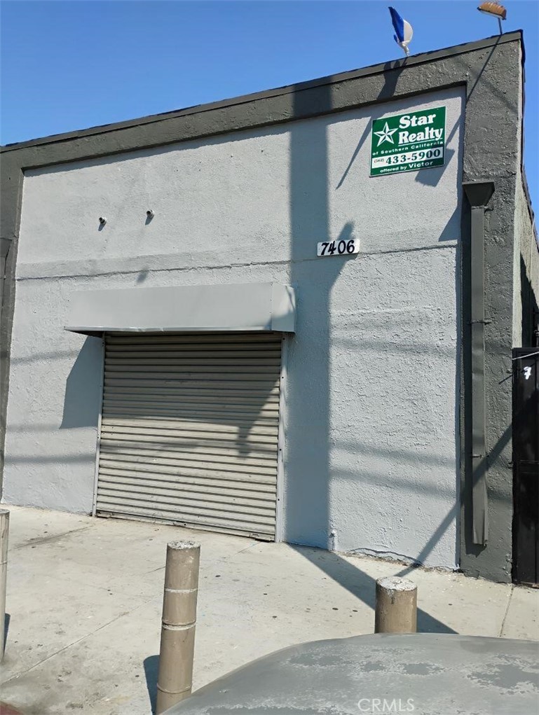 Large commercial building (1000 SF) and single family residence i(676 SF) in rear.