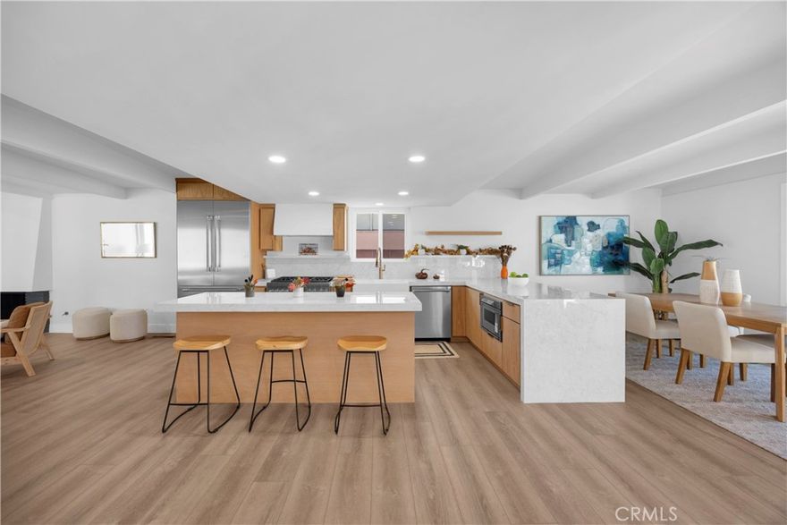 Mid-Century Modern Masterpiece – The Starlite Model (Built in 1957 by Ross Cortese - Revived in 2025)

Step into timeless design and modern comfort with this exceptionally rare Starlite model, built in 1957 by visionary developer Ross Cortese—his elegant nod to the celebrated works of Eichler and Cliff May. Thoughtfully restored and brought back to life, this mid-century modern gem captures the essence of open-concept living and seamless indoor-outdoor flow.

Set on a prominent 8,400 sq ft corner lot, this single-level 4-bedroom, 2-bath home stands as a focal point of the neighborhood. The drought-tolerant front courtyard and custom Trex deck porch lead to a designer fiberglass entry door accented with premium hardware—an inviting prelude to what lies within.

Inside, the home showcases clean architectural lines, expansive windows, and a signature central fireplace, original to the 1957 design. The open living space flows effortlessly into a stunning chef’s kitchen featuring Thermador stainless-steel appliances, a built-in refrigerator/freezer, lux porcelain quartz countertops, and white oak rift cabinetry hand-selected for both beauty and authenticity.

A modern tri-folding door opens the living area to a Trex deck patio in the backyard, creating a perfect indoor-outdoor living experience ideal for entertaining or relaxing. The home is equipped with new central air, copper plumbing, a new 200 amp electrical panel, an E.V. charger at the garage, dual pane windows, and architecturally integrated slab ducting—a rare original design feature.

Each of the four bedrooms and two baths showcases designer finishes curated by Creative Surfaces of Naples, including custom tilework, upgraded lighting, copper plumbing, and modern fixtures. Every detail has been considered, from the designer hardware to the brand-new driveway with custom faux grass inlays. 

A true mid-century modern revival—where iconic architecture meets modern luxury. Best of all, this home is situated in the Community of Rossmoor and is part of the Award-Winning Los Alamitos Unified School District in Orange County, Ca.