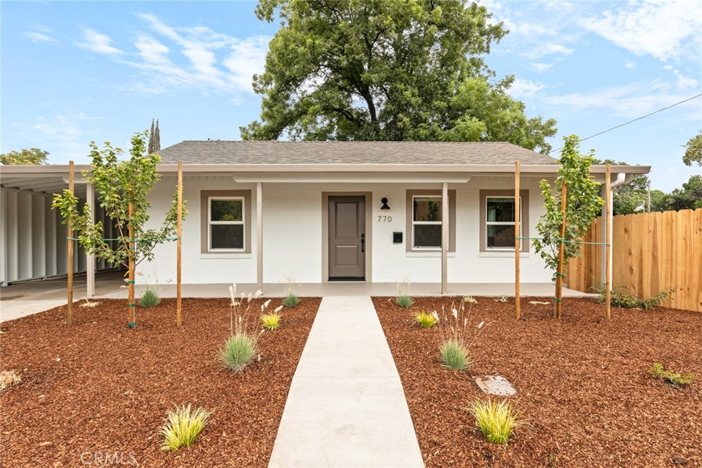 Charming and move-in ready! Conveniently located near shopping, dining, and with quick access to Highway 99, this 2-bedroom, 1-bathroom home has everything you need for comfortable living. Step inside and you’ll be welcomed by stylish laminate flooring, soft-toned walls, open-beamed ceilings, and a spacious living area ideal for unwinding after a busy day. The fully appointed kitchen features elegant painted cabinetry, ample counter space, updated stainless steel appliances, and a gas range—ready for all your cooking adventures. Both bedrooms offer generous space, roomy closets, and a cozy atmosphere. The bathroom is designed for ease with a nicely sized vanity and a large walk-in shower. Additional highlights include recessed lighting, ceiling fans throughout, an indoor laundry area, a covered carport, and more! The expansive backyard is a blank canvas for your outdoor vision—host barbecues, soak up the sun, or plant your dream garden. Whether you're searching for a new home or a promising rental property, this one checks all the boxes.