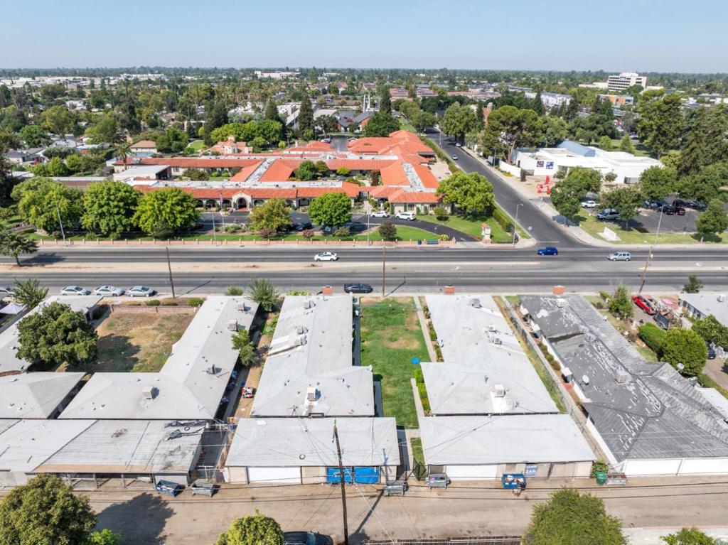 This recently renovated 4-plex in Fresno's Mayfair neighborhood is a solid investment opportunity. All four units are fully occupied with strong rental rates and reliable tenants. The property has a spacious lot and large unit sizes with 4-car garages which is popular to both renters and investors. Located within walking distance of Manchester Center, a vibrant hub featuring a mall, movie theater, and weekly farmers market. A great commute location near popular local restaurants, schools, and main highways. Fresnos rental market is thriving, ranked as the 9th most competitive in the nation with a vacancy rate of just 2.9%, tying for the 6th lowest in the U.S.. Since 2019, fair market rents in Fresno have increased by 50%, with average monthly rents now at $1,285 and reaching up to $1,907 depending on unit size and location. The combination of a prime location, robust market fundamentals, and a fully leased, updated property positions this 4-plex as an attractive option for investors.
