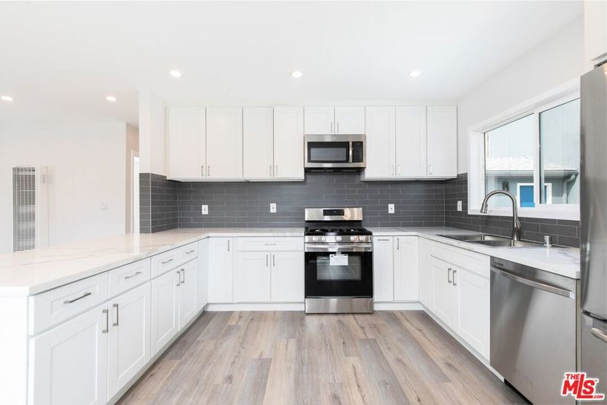 *Please note this is a freestanding front house with 3 units behind. "Oh Toto, there's no place like home!"We totally agree, Dorothy, and we're completely over the rainbow for this amazing 3BD/2BA home in Culver City. Located in a quiet neighborhood near the 405 and Venice, this modern home will make you believe that sometimes, dreams really do come true. Come, let's take a tour. First, step into the front door, and find yourself in a gorgeous living room, complete with sleek new wood floors, stunning decorative fireplace, and recessed lighting. I mean, I don't think we're in Kansas anymore. Next, come check out this kitchen! Dust off your chef's hat, break out your nicest apron, and click your heels three times, because you're going to make some culinary magic right here! With miles of gorgeous quartz counters, new white shaker-style cabinets, a deep double sink, and all brand new stainless steel appliances, this open style kitchen will be the talk of ALL your friends, whether they be lions, scarecrows, or tinmen! Oh my! Keep walking down this yellow brick road with us, and explore the three bedrooms, each of which includes its own closet and wall-mounted a/c unit. The two bathrooms have been gorgeously renovated with modern contemporary finishings, and a brand new washer & dryer are alsoi ncluded. We're almost done with this tour! Step outside, and you can be king of your forest! If your forest were drought tolerant urban landscaping of course! You've also got driveway parking enough for 2 cars in tandem, and room for a storage container if needed. We thank you very sweetly, for touring with us so completely! Alright, maybe we stretched a little for that one, but we're serious when we say that this place is worth a journey. Maybe you'll even make some friends along the way.