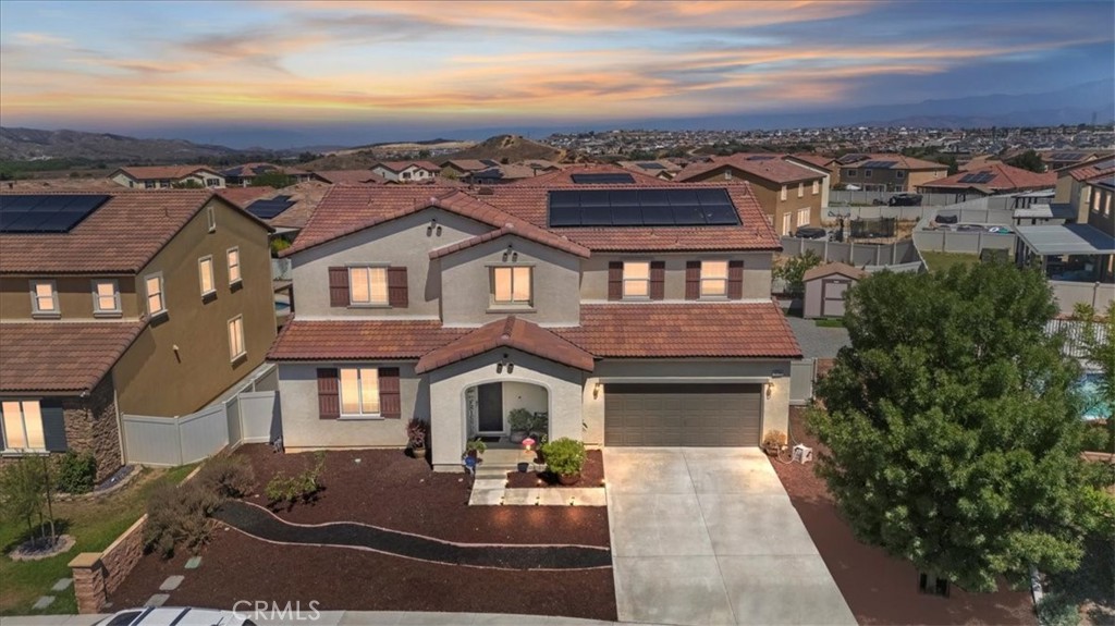**Like a Model Home... this Wonderfully Upgraded 5 Bed/3 Bath Home is located on a quiet interior street within the Exclusive Gated Olivewood Community. The Most Desirable floorplan in the Neighborhood, this home features a Sought After First Floor Bedroom and Full Bath. Very Open Layout and High Ceilings and Natural Light create a comfortable space in the Family Room, Dining and Kitchen that feels Expansive! The Gorgeous Kitchen has been Upgraded with a Stunning Granite counter tops, Beautiful Stainless-Steel appliances, Walk-In Pantry and Large Island with Sink and additional Seating that Opens to the Family Room. Beautiful Laminate and Fresh Paint throughout the Home! The spacious backyard is significantly larger than surrounding homes. It includes a Very Large Covered Alumawood Patio, Potential RV Parking, Tough Shed and High-End Hot Tub included. The Massive yard is lined with dozens of Fruit Trees, very large Artificial Grass space with built in drains... Perfect Space to Entertain all your Friends and Family! Olivewood Community features Amazing Amenities like Clubhouse, Pool, Gym, Parks, etc. Located minutes off the 10 & 60 FWY for and excellent commute location. Come Take a Look and Fall in Love!