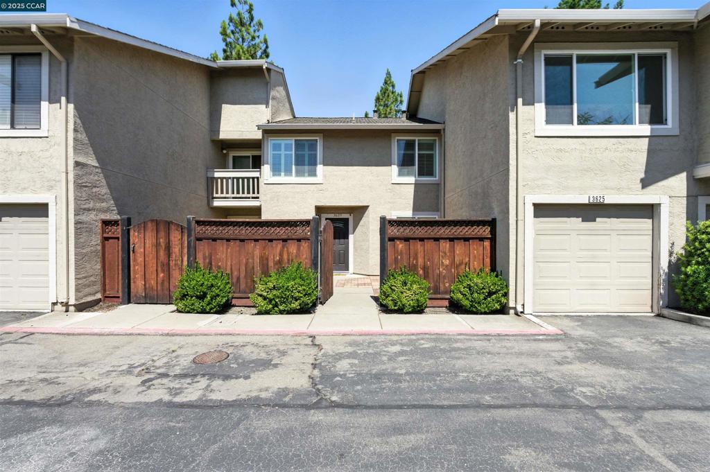 Experience the perfect blend of style, comfort, and privacy in this updated townhome nestled in the heart of San Ramon. Bathed in natural light, the spacious interior features high ceilings, wide-plank flooring, and a beautifully remodeled kitchen with sleek cabinetry, granite countertops, and newer appliances. The inviting living room, complete with fireplace and built-in breakfast bar, flows seamlessly into the private backyard, backing to open space, ideal for relaxing or entertaining. Upstairs, you'll find three bedrooms, updated bathrooms, and a spacious primary suite with vaulted ceilings and custom closets. The attached 1-car garage and laundry offer added convenience. Step outside to your own low-maintenance retreat surrounded by mature trees and fencing for extra privacy. Located in a highly desirable gated community near top-rated schools, parks, shopping, and dining. With its upscale finishes and turnkey appeal and additional parking spot this home is an exceptional value in a prime location.