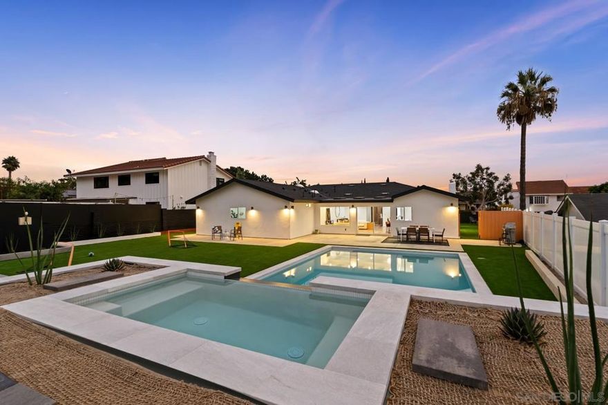 Meticulously remodeled and reimagined, this single-level 5-bedroom, 3-bath home blends modern coastal style with easy livability. Light-filled spaces with skylights and large sliders create seamless indoor-outdoor flow to expansive entertaining areas. The chef’s kitchen features quartz countertops, new appliances, and an extended peninsula with bar seating that opens to the great room. The fifth bedroom has its own exterior entrance—ideal for a private office or guest suite. Both front and back yards are flat, fully fenced, and newly redesigned, with new hardscape, extensive artificial turf, manicured plantings, and a new saltwater pool and elevated spa with an ocean view. Nearly every element is new, including the roof, HVAC, dual-pane windows, electrical panel with EV charger, tankless water heater, fencing, flooring, lighting, and doors. Located in Cardiff-by-the-Sea, you’re minutes from Cardiff State Beach, Swami’s, San Elijo Lagoon, and local favorites like Pacific Coast Grill, Las Olas, and Seaside Market. Enjoy top-rated schools, boutique shops, cafés, and the best of the North County lifestyle.