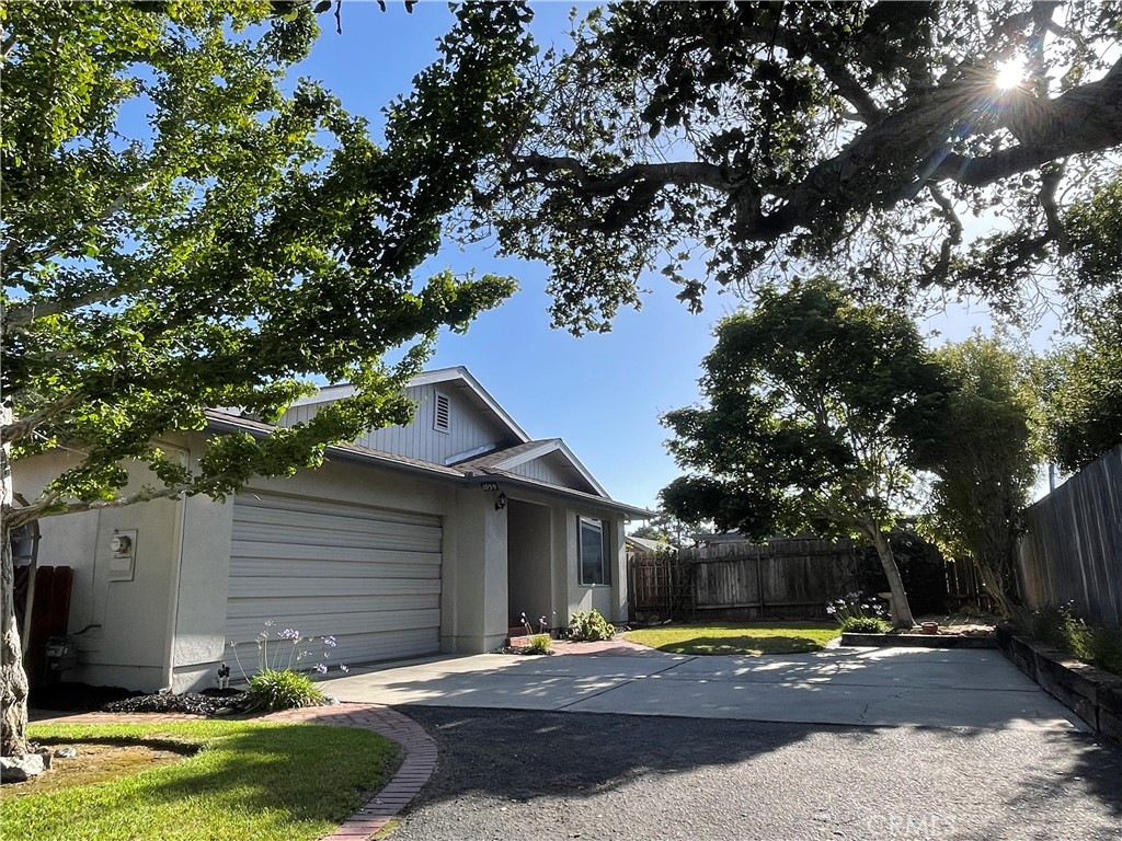 Well maintained property, tucked away in the desirable "Tree Streets" neighborhood of Arroyo Grande. This 3 bedroom 2 bathroom home was built in 1984 and sits on a 6,600 sf lot that includes mature apple, orange, fig and lemon trees. As you enter through the front door, there is a formal family room and dining area. Off the kitchen, is a separate living room with a brick wood burning fireplace and a deck overlooking the backyard which is a gardeners dream with beautiful hardscape, drip system and a small green house. Newer roof has been installed and the exterior has been recently painted. Centrally located, this home is walking distance to nearby elementary, junior high and high schools as well as popular restaurants and coffee shops. Downtown Pismo Beach and the Village of Arroyo Grande are just a short 5 minute drive.