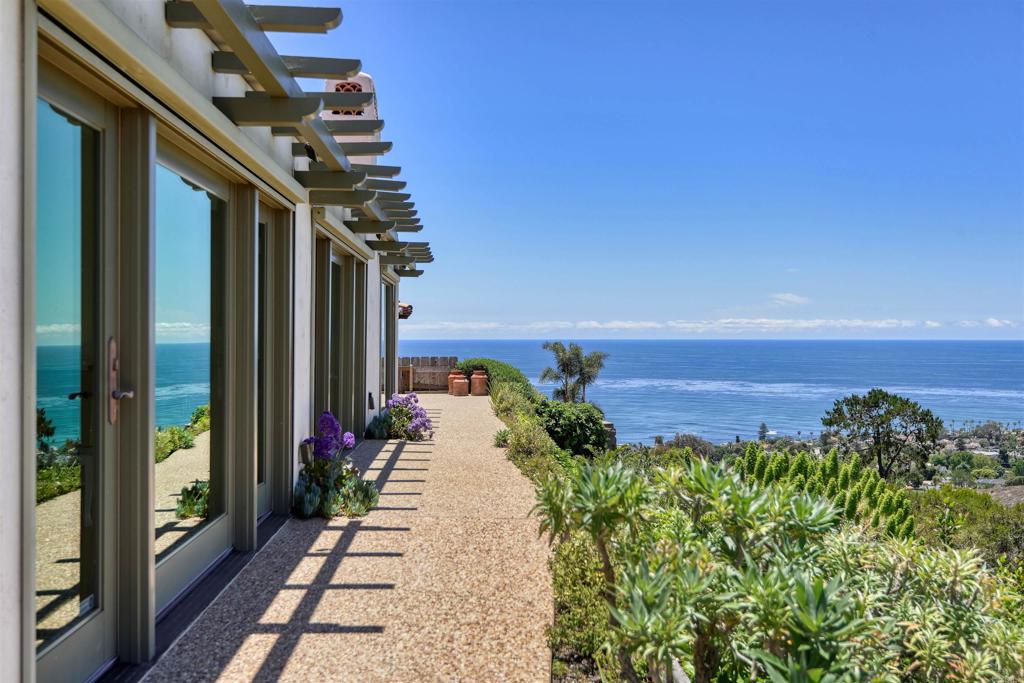 Beautifully remodeled in 2012, this single-story Spanish-style home offers panoramic ocean and canyon views from a quiet double cul-de-sac in the Muirlands neighborhood. Featuring 2 bedrooms plus an optional third currently used as an office, the home includes an open floor plan, designer finishes, hand-painted Mexican tile, hardwood floors, and natural stone bathrooms. $12,000 - $13,500/mo, depending on lease terms and dates. Minimum 14 days, short-term fully furnished.
