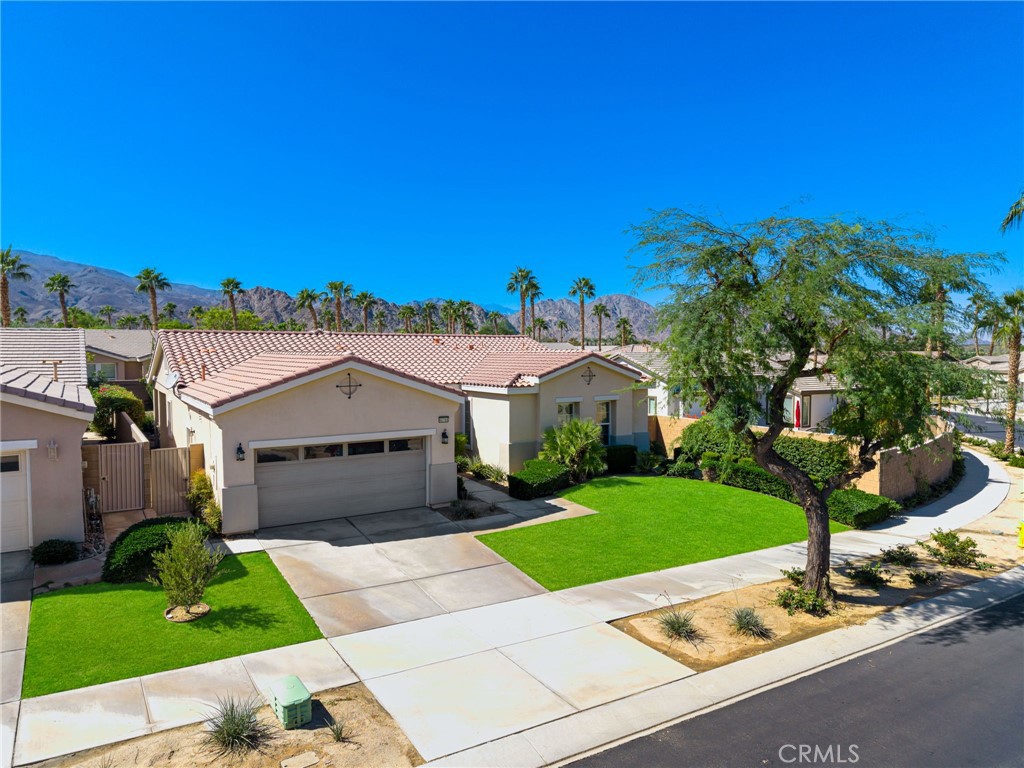 Simply stunning! From the warm winter sun to stunning desert sunsets and starry nights, come enjoy resort-style living in Trilogy at La Quinta. And this home is stunning, too! The desirable Monarch plan is spacious and flexible; begin with 1,845' of living space, 10-foot high ceilings and a light & bright interior. An expansive great room opens to the chef's kitchen complete with bar seating, island seating, granite countertops and an abundance of cabinetry. There are two spacious bedrooms plus two bathrooms, along with a den featuring a French door entry making it easy to use as a third bedroom if desired. The primary suite is a true retreat; a bay window overlooks the backyard while a French door offers direct outdoor access. The attached primary bath sparkles with a spa-like oversized shower, dual sinks and granite countertops. Other custom builder upgrades are found throughout the home, including an oversized entry door and baseboards, pull-out shelving in the kitchen and more. One of the best upgrades? The patio extension off of the kitchen nook and great room, with an extended roofline done at the time of construction. The interior furnishings and artwork were curated with care over the years and make this home truly move-in ready. The oversized 9,148' lot provides plenty of room to roam and has been professionally landscaped to reflect the owners' love of the desert and surrounding mountains. The Palo Verde trees are spectacular! First time on the market; when new, the owners had to "win" during the builder's new construction lottery to purchase this model and premium lot.
They have enjoyed rest, relaxation and adventure here, and hosted family and friends for birthdays, holidays and getaways - and even an engagement! And for a bit more info on Trilogy at La Quinta, it is a 55+ guard-gated community offering almost endless social and recreational opportunities. Prefer peace and quiet? Relax and soak up the sun and nature views. Want to be pampered? The day spa offers massages, facials and more. Perhaps you'd like to swim laps, partake in pickleball, golf or tennis? It's all here, along with a billiards room, gym, indoor running track, clubhouse, cafe and so much more. Enjoy time in Old Town La Quinta with shopping, dining and art shows, and world-class entertainment at the nearby Empire Polo Club. Venture a bit further and enjoy The Shops on El Paseo or concerts at the Acrisure Arena in Thousand Palms where Paul McCartney just performed!