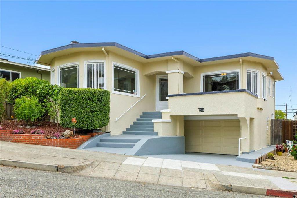 One-of-a-kind Prairie-style split-level home showcases signature horizontal lines, natural materials, and an open floor plan-all nestled in the heart of vibrant and highly sought-after upper Rockridge. Enjoy a prime, walkable near College Avenue, Oakland Tech and Claremont Country Club. Just minutes by bike to Lake Temescal, Rockridge BART, Trader Joe, and even UC Berkeley. A truly convenient, car-free and hassle-free lifestyle awaits. This versatile property functions as both a duplex and single-family. Main level features a front deck, glass-panel entry, living room with wood-burning fireplace, dining room, and hardwood floors throughout. Enjoy wood cabinetry, natural light and outswing windows. Kitchen with tile counters, appliances, and eating area. Upper level offers three spacious bedrooms, connecting sunroom, and a full bath. The spacious ground-level studio offers an open-concept layout with its own private entrance from the backyard, plus interior access from the main. It features a bright living and sleeping with ample windows, a kitchen-ready room and full bath. Shared laundry/utility room, garage and basement storage. Ideal for multi-generational living or rental income. Angel number 5555 is calling, don't miss this rare opportunity and owning this architectural gem.