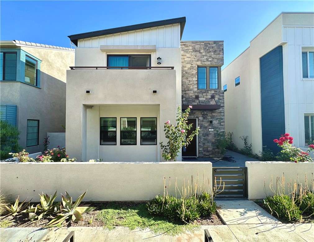 Welcome to this stunning 2,399 sqft residence featuring elegant wood flooring and both front and back yards, perfect for indoor-outdoor living. Located in the highly sought-after Great Park community, this home offers a desirable West-facing California Room and spacious side yard, ideal for entertaining or relaxing.Enjoy eco-friendly living with leased solar panels already installed. Just steps away from the scenic Agua Chinon trail, you’ll catch breathtaking sunset views right from your neighborhood.Inside, the home boasts premium KitchenAid appliances, including a double oven, a drop-in laundry room sink, 8-foot interior doors, and a multi-panel sliding glass door that seamlessly connects the indoor living space to the outdoor patio. The kitchen shines with crisp Stria quartz countertops, soft-close cabinetry, and a luxury finish package throughout. Don’t miss this rare opportunity to own a turnkey home in one of Irvine’s most vibrant and family-friendly communities.